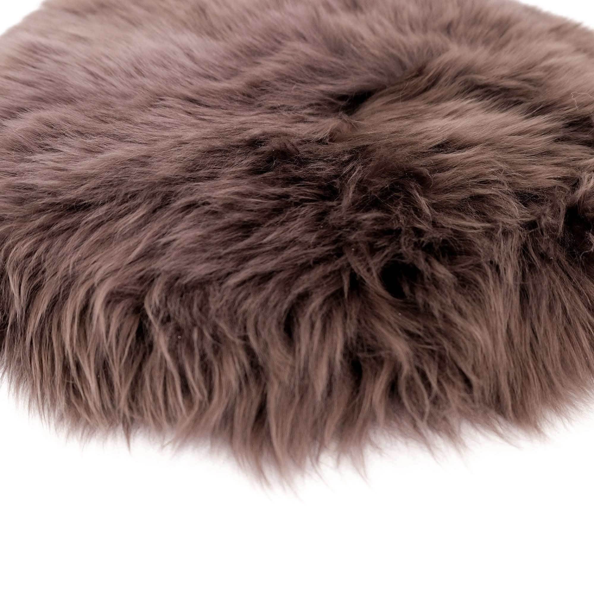 Gray sheepskin rug with long wool fibers shown from above on white background. - Yellow Earth Australia