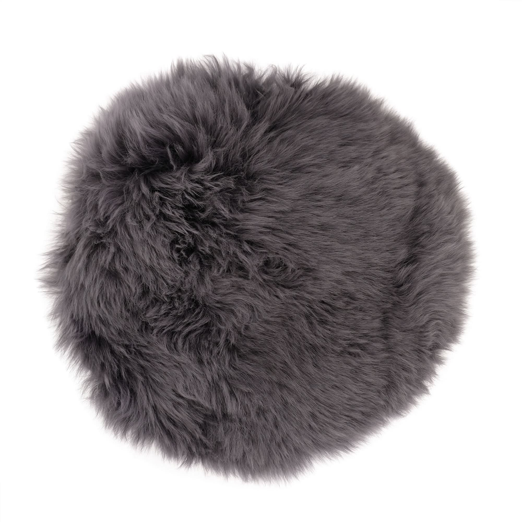 Grey sheepskin round rug with thick woolly texture viewed from above. - Yellow Earth Australia