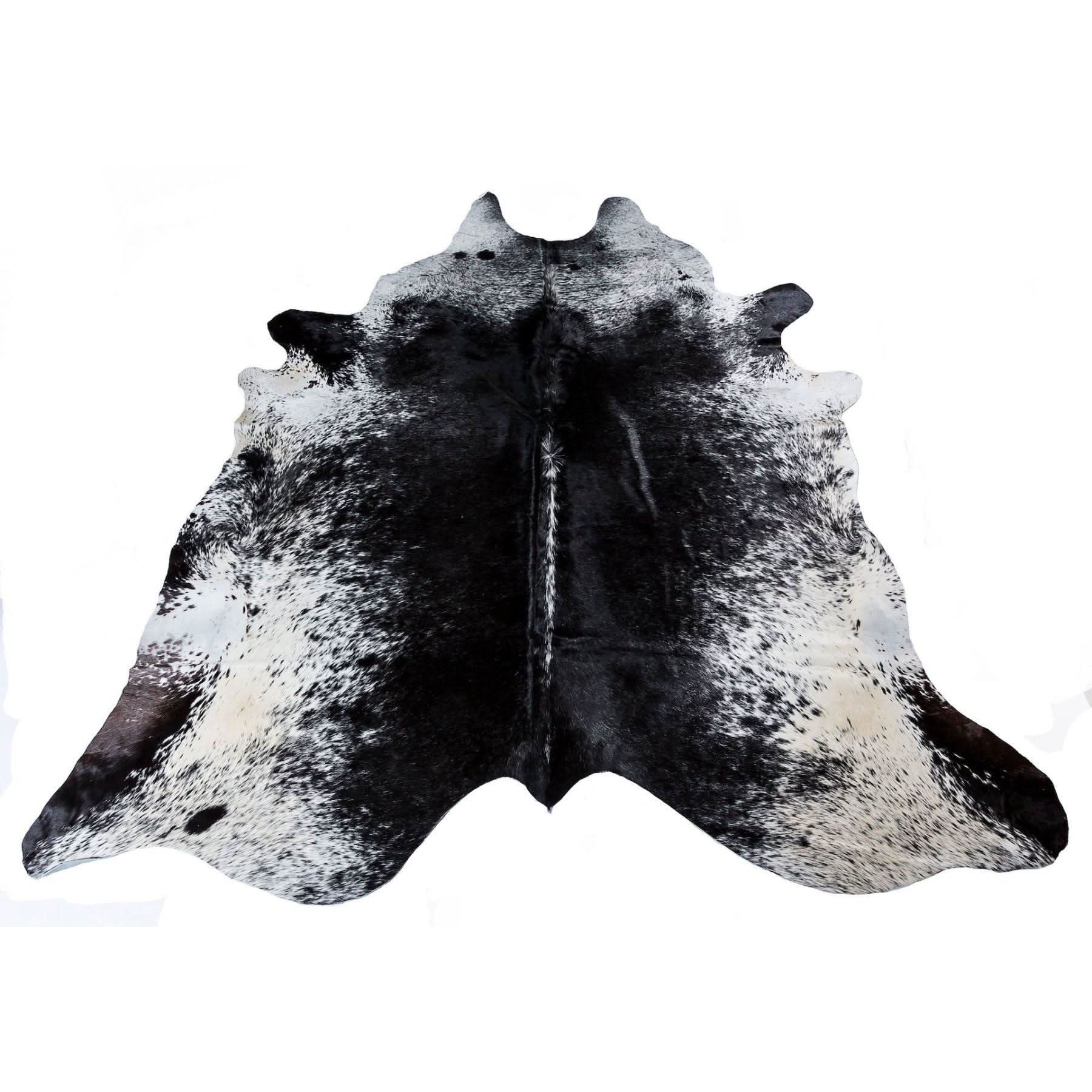 Black and white speckled cowhide rug viewed from above showing natural texture and markings. - Yellow Earth Australia