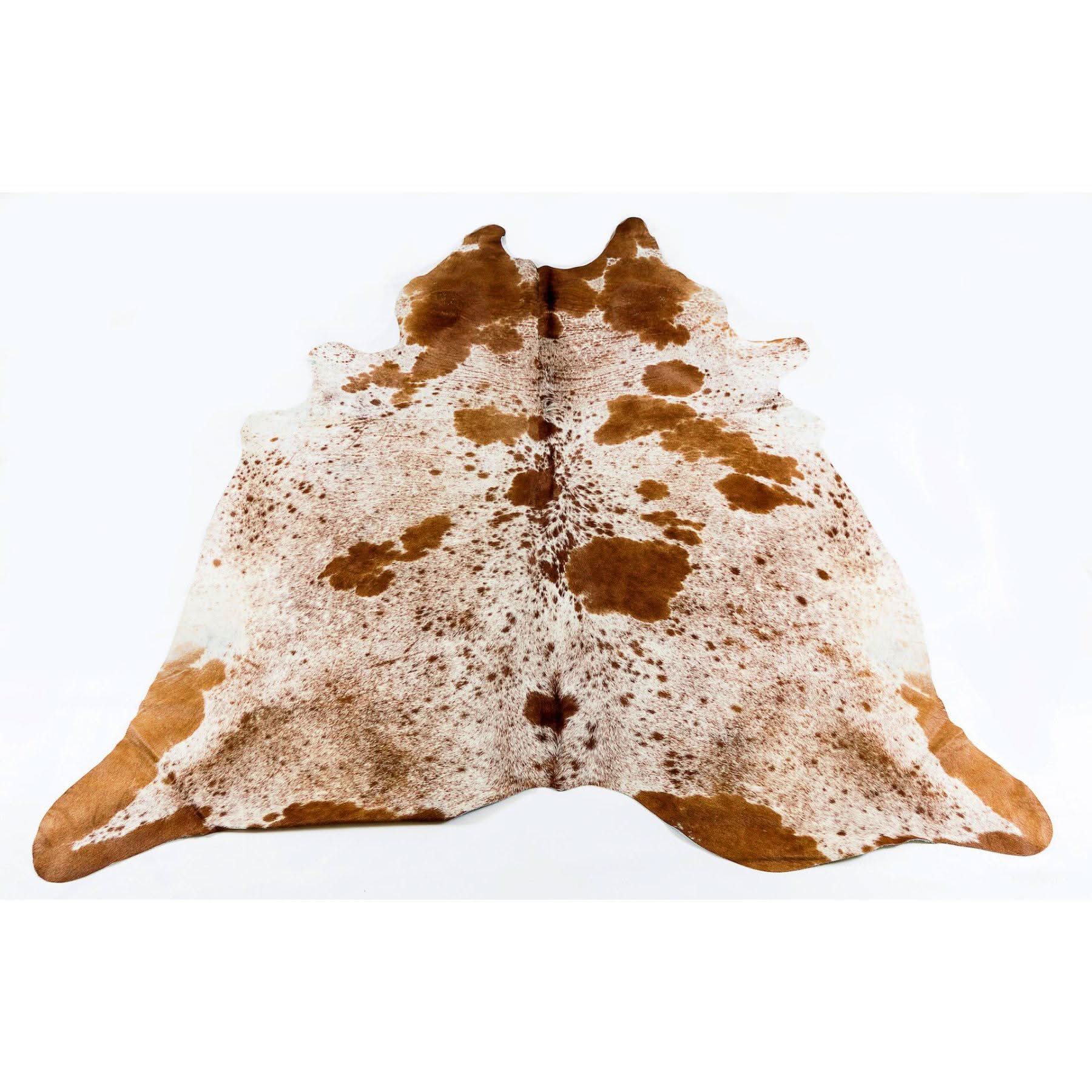 Brown and white speckled cowhide rug displayed flat on white background. - Yellow Earth Australia