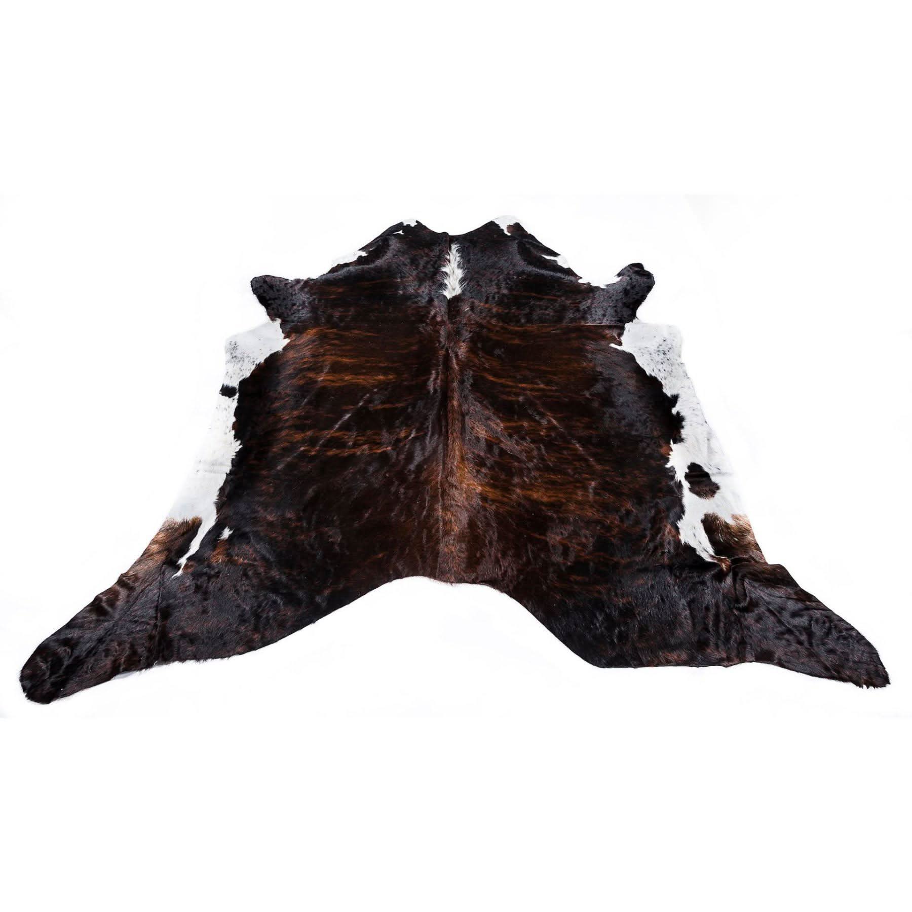 Dark brown cowhide rug with white markings displayed flat from above. - Yellow Earth Australia