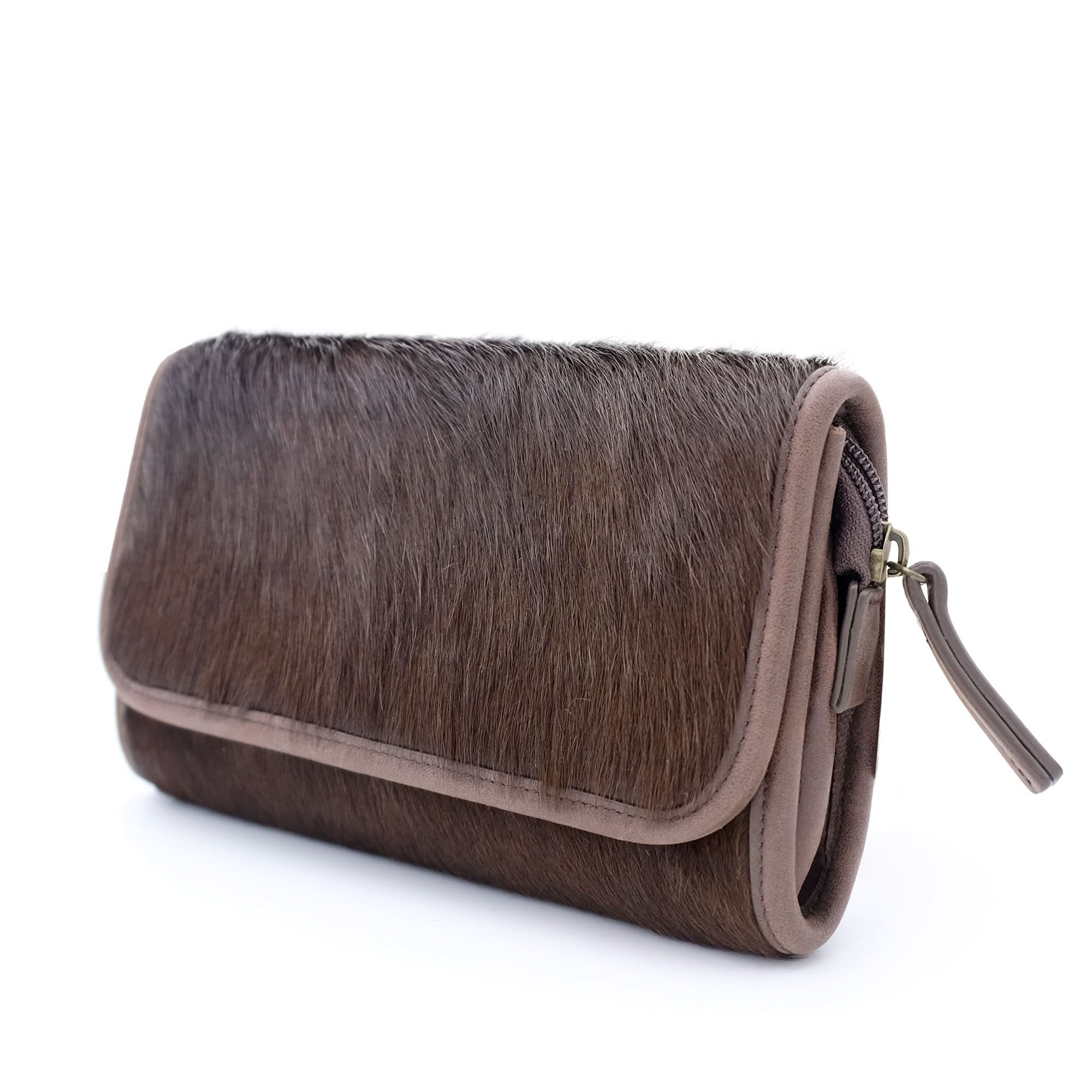 Grey sheepskin wool clutch wallet with textured fur front and suede trim, angled view. - Yellow Earth Australia