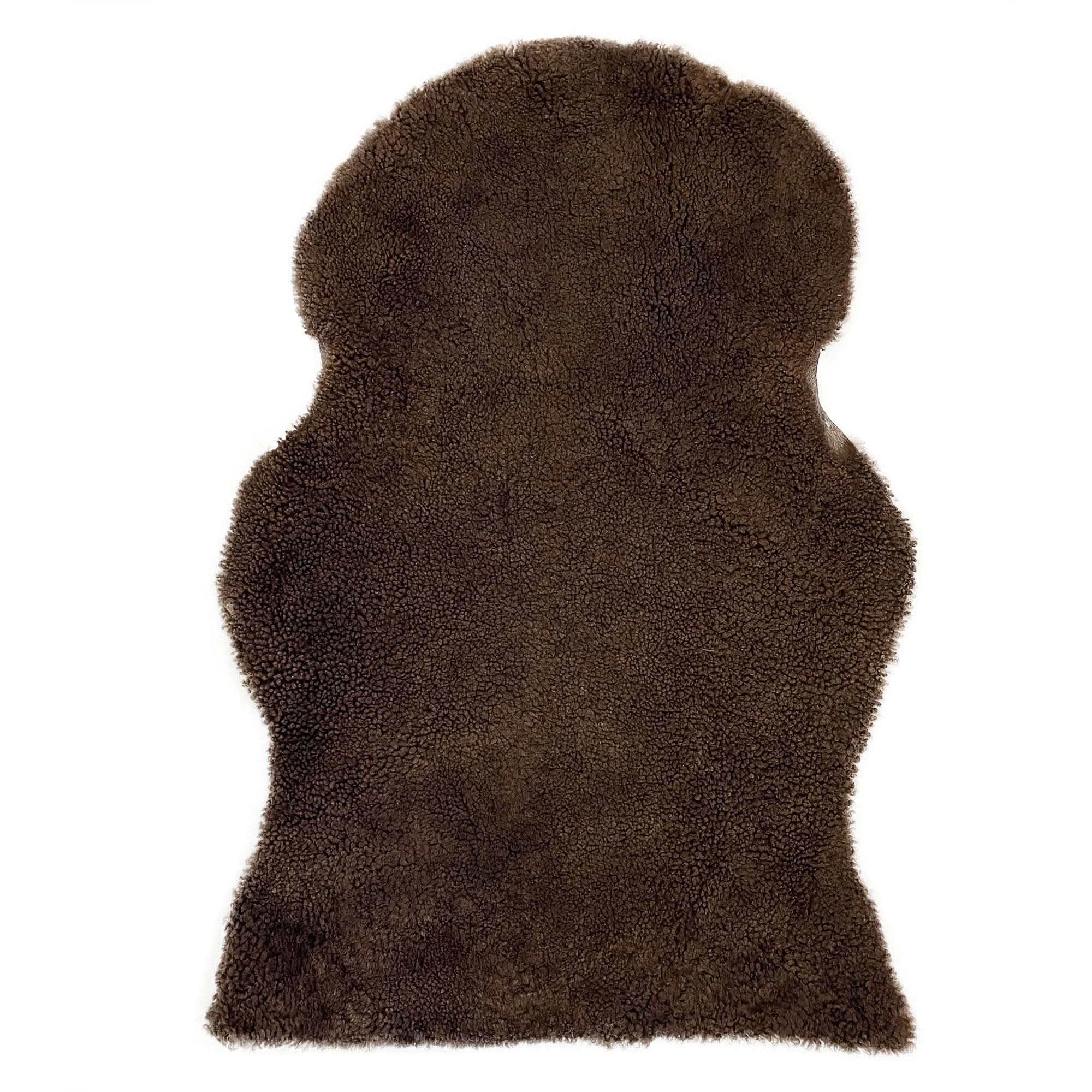 Brown sheepskin rug with soft wool fleece texture, top view. - Yellow Earth Australia