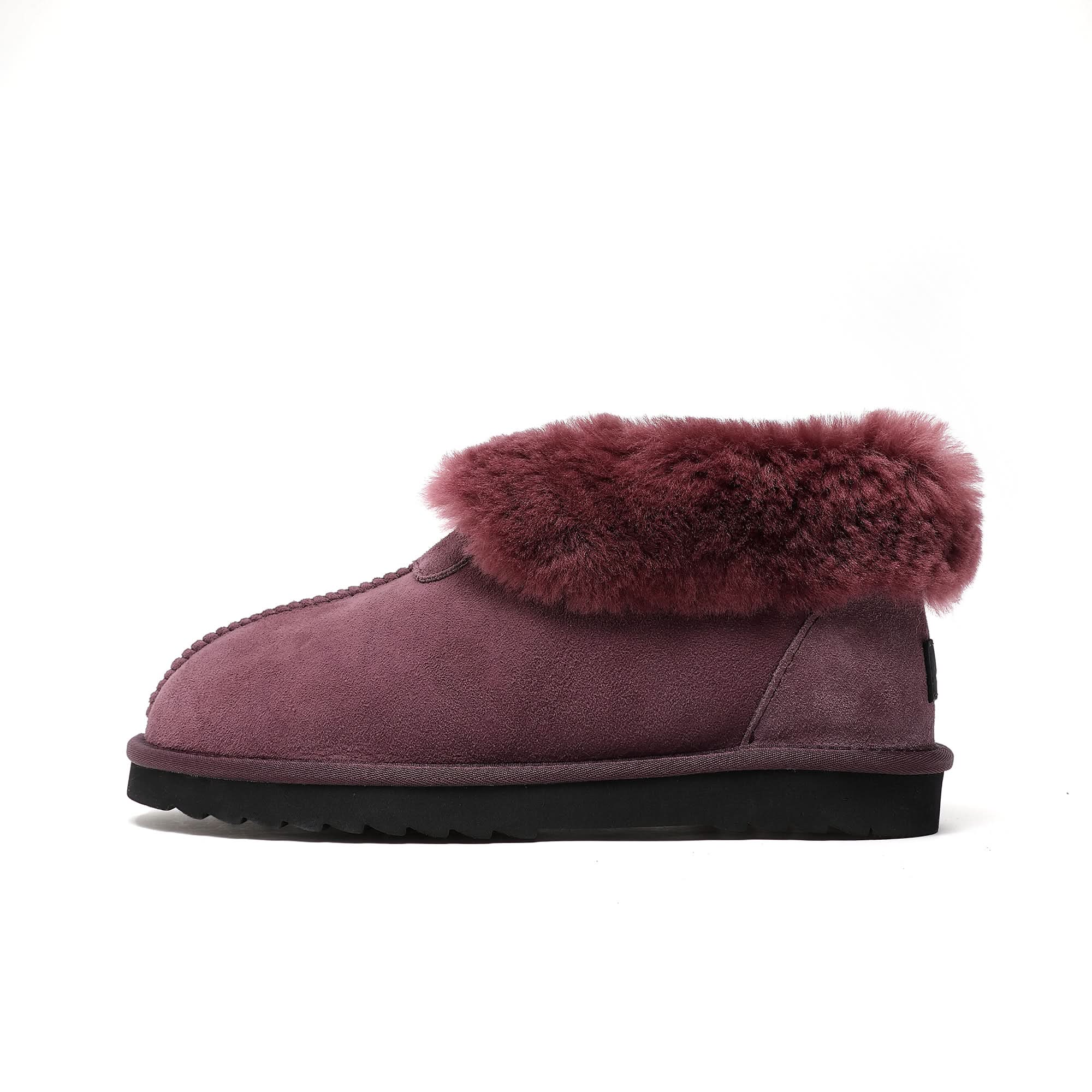 Burgundy sheepskin slipper boot with fluffy wool cuff and black sole, side view. - Yellow Earth Australia