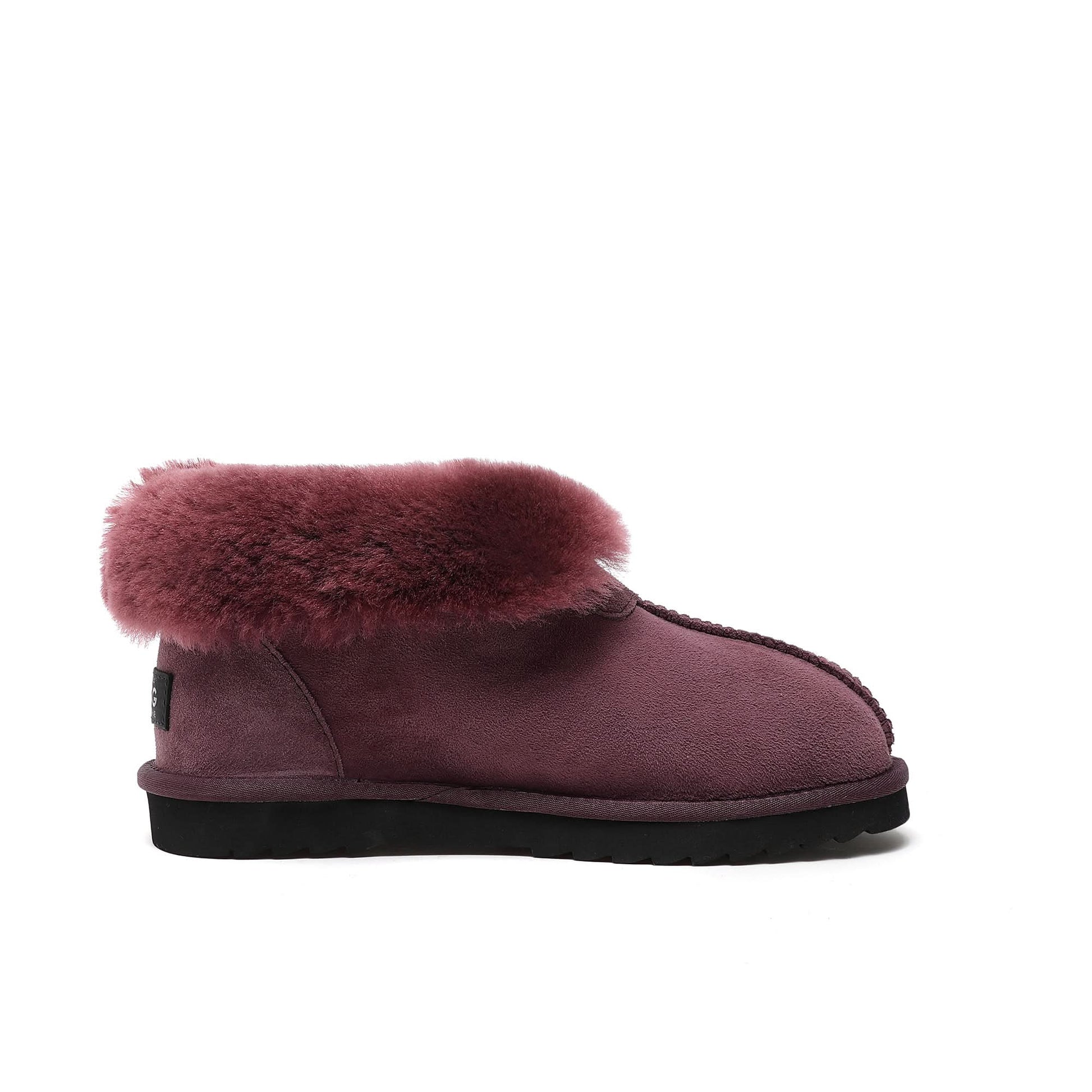 Burgundy sheepskin boot with fluffy wool collar and black sole, side view. - Yellow Earth Australia
