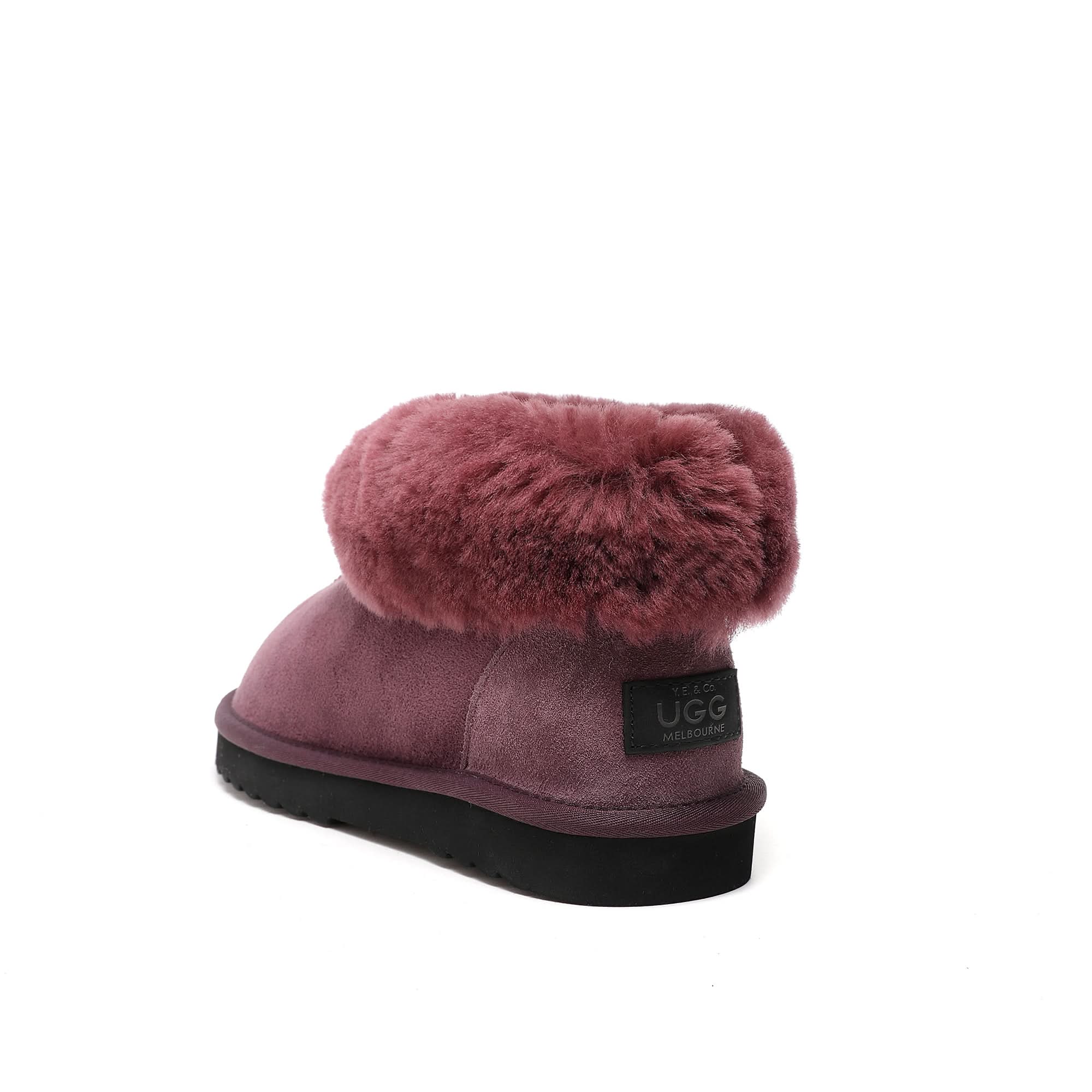 Mauve sheepskin boot with fluffy wool cuff, displayed from rear angle on white background. - Yellow Earth Australia