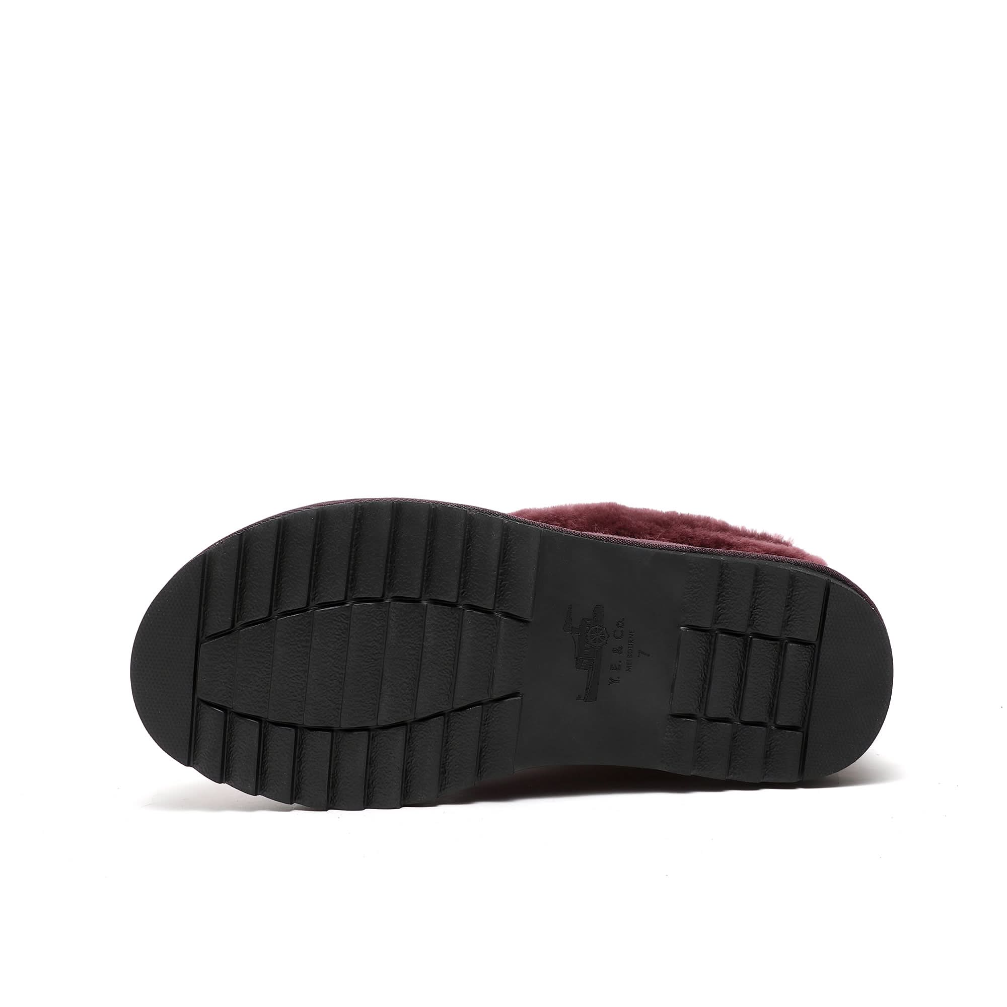 Burgundy sheepskin slipper with black rubber sole, bottom view. - Yellow Earth Australia