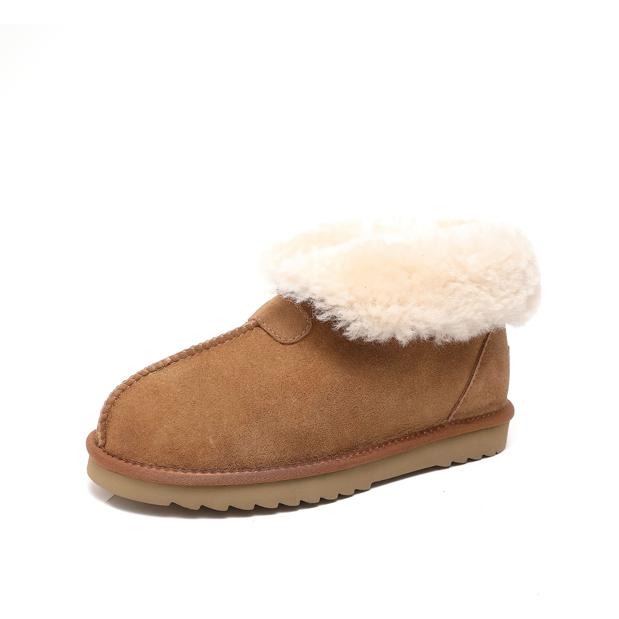 Classic tan sheepskin ankle boot with plush wool lining on white background