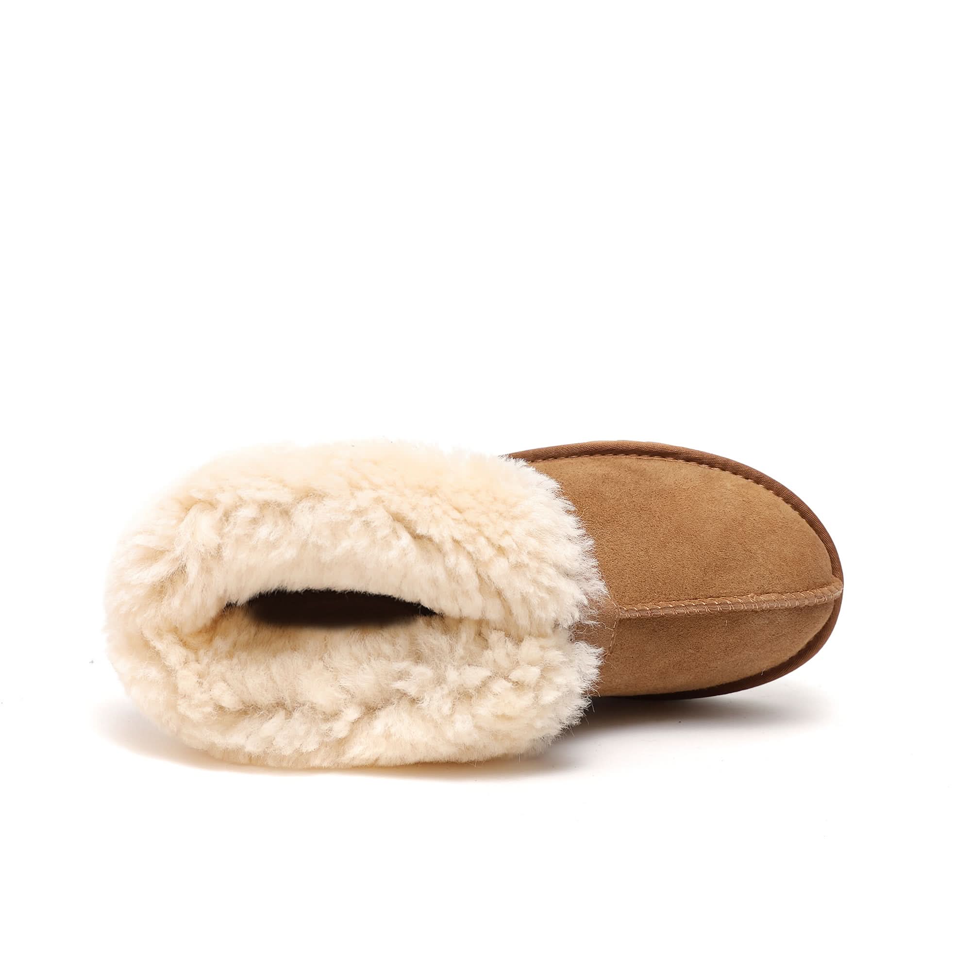 Tan sheepskin slipper with plush wool lining, viewed from above on a white background