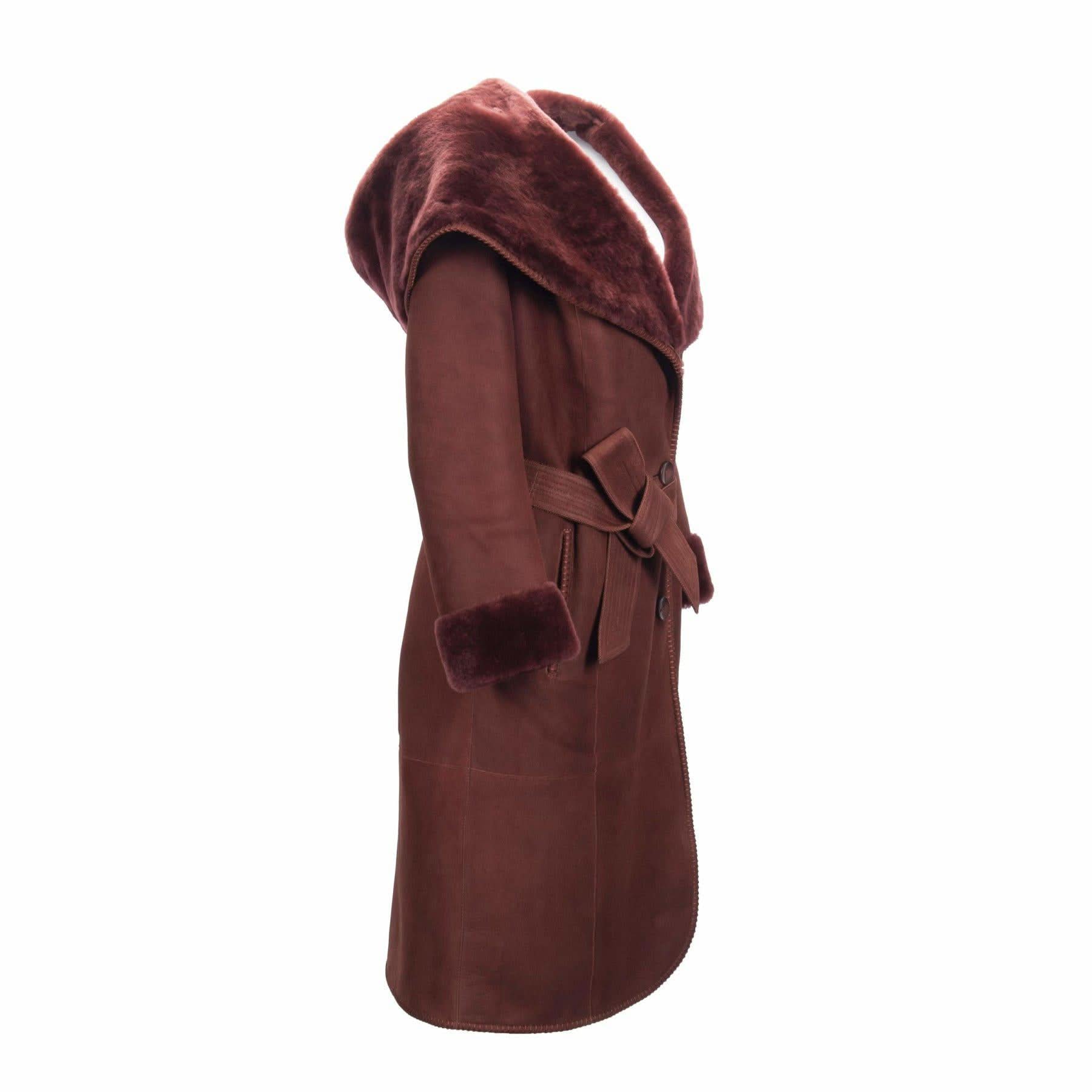 Burgundy sheepskin wrap coat with fur-lined hood, displayed on mannequin from side angle. - Yellow Earth Australia