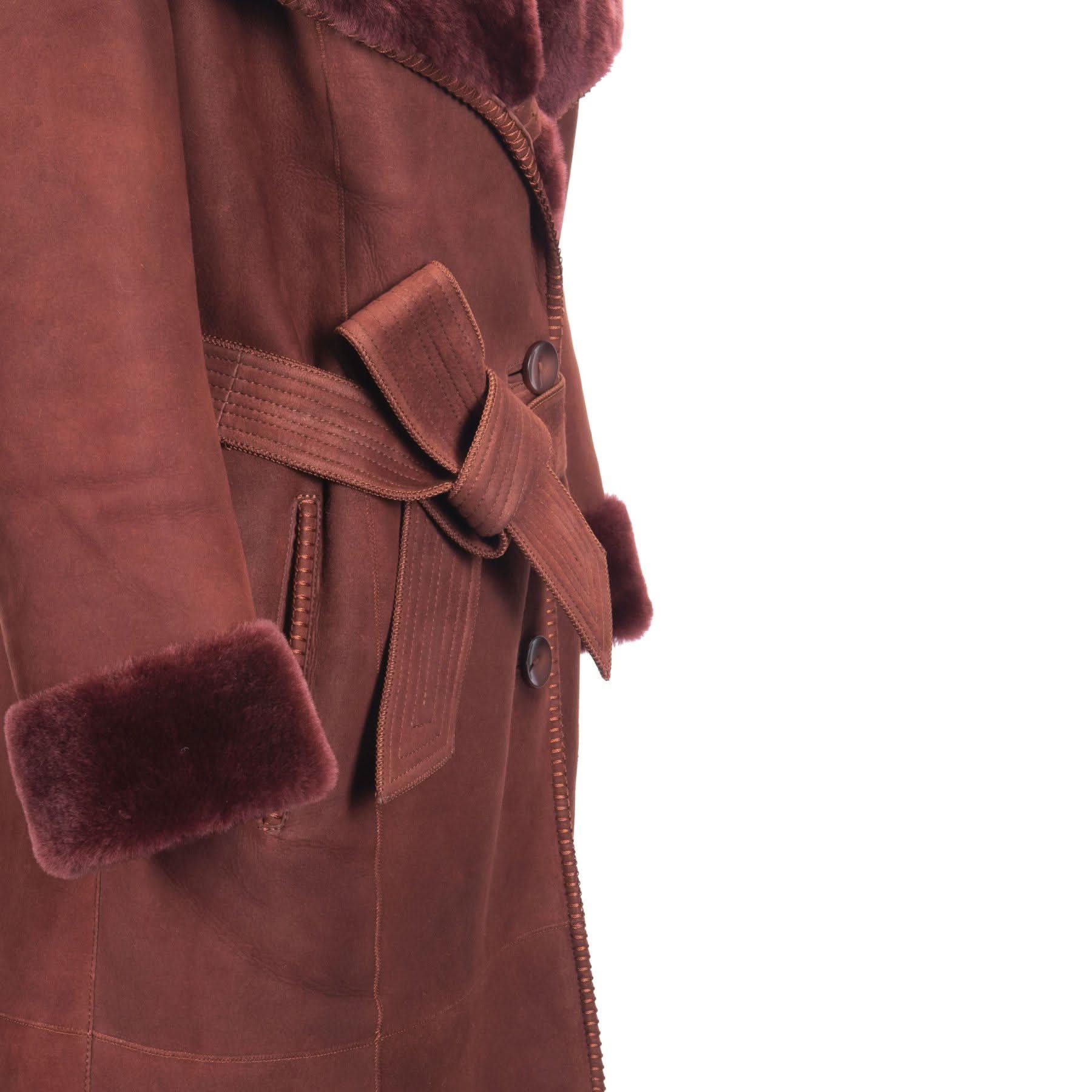 Burgundy sheepskin coat with fur collar and cuff detail, side view. - Yellow Earth Australia