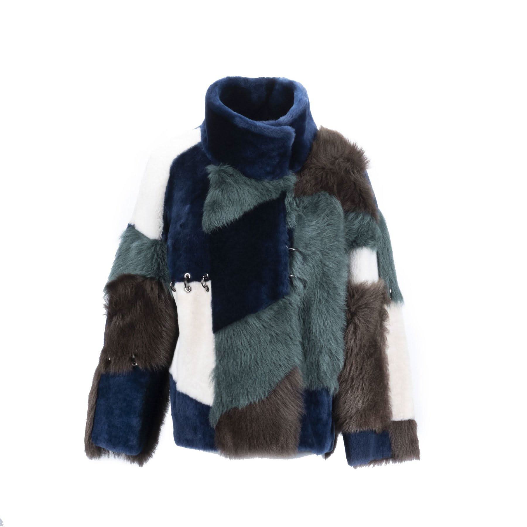 Colorblock sheepskin patchwork jumper with navy, grey, white and brown fur panels in front view. - Yellow Earth Australia