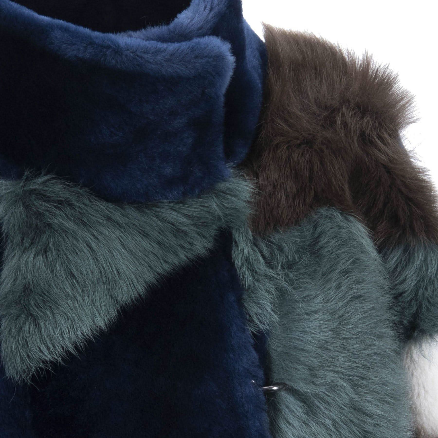 Luxe fur-trimmed sheepskin wrap in navy and sage green, close-up detail view. - Yellow Earth Australia