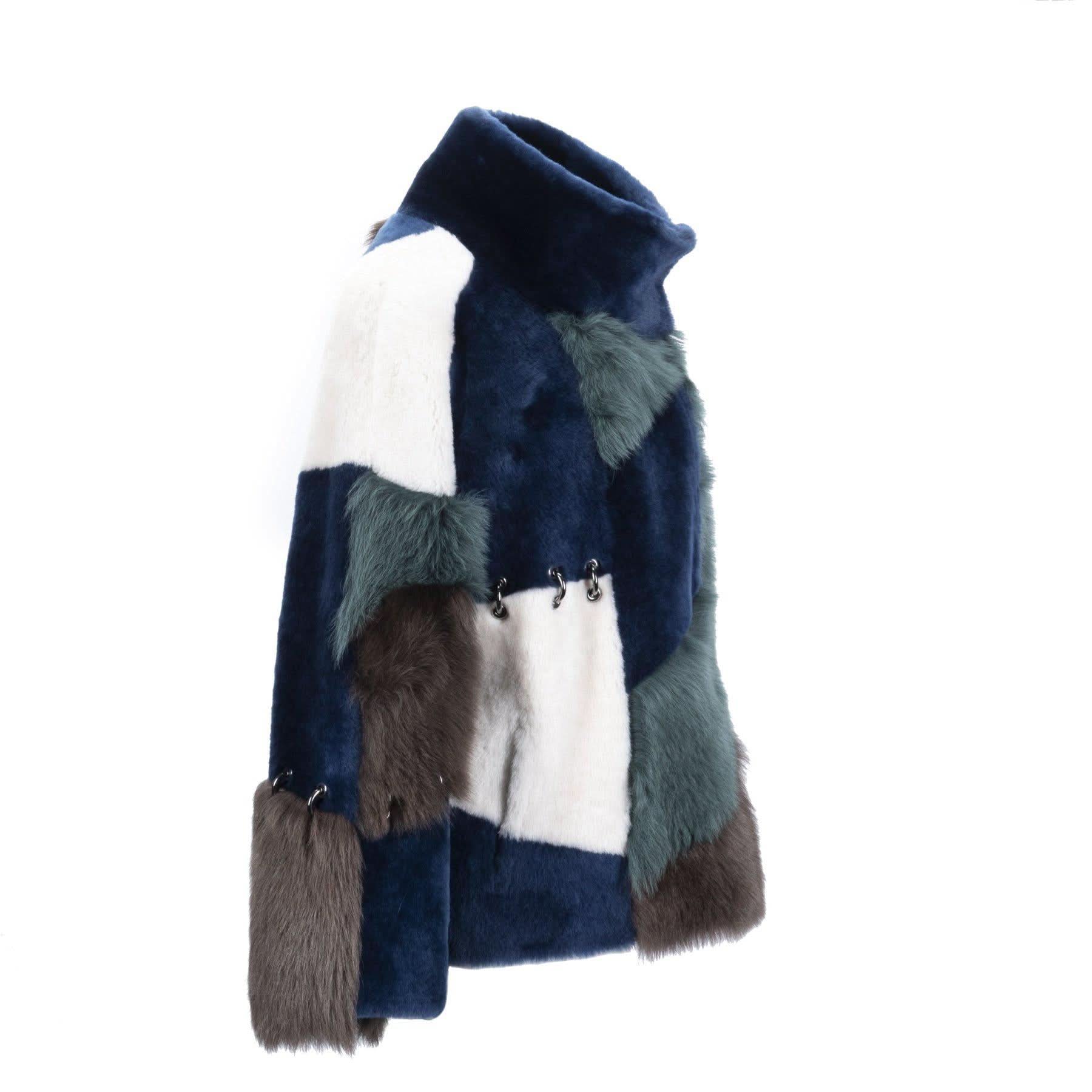 Colorblock fur stole in navy, white, and grey with metal clasp detail, displayed on mannequin. - Yellow Earth Australia