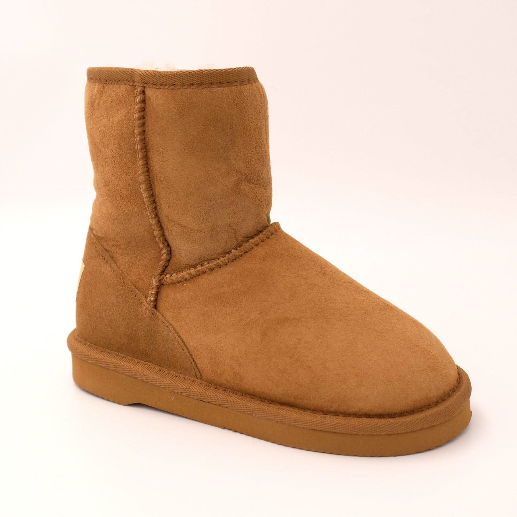 Tan sheepskin boot with wool lining, side view on cream background. - Yellow Earth Australia