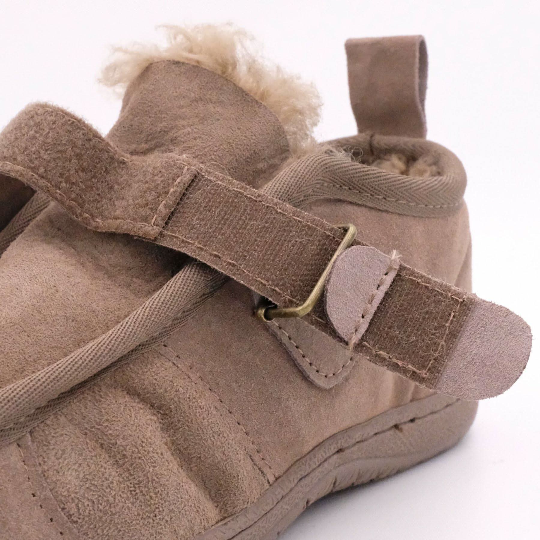 Beige sheepskin baby booties with wool lining and buckle strap, side view. - Yellow Earth Australia