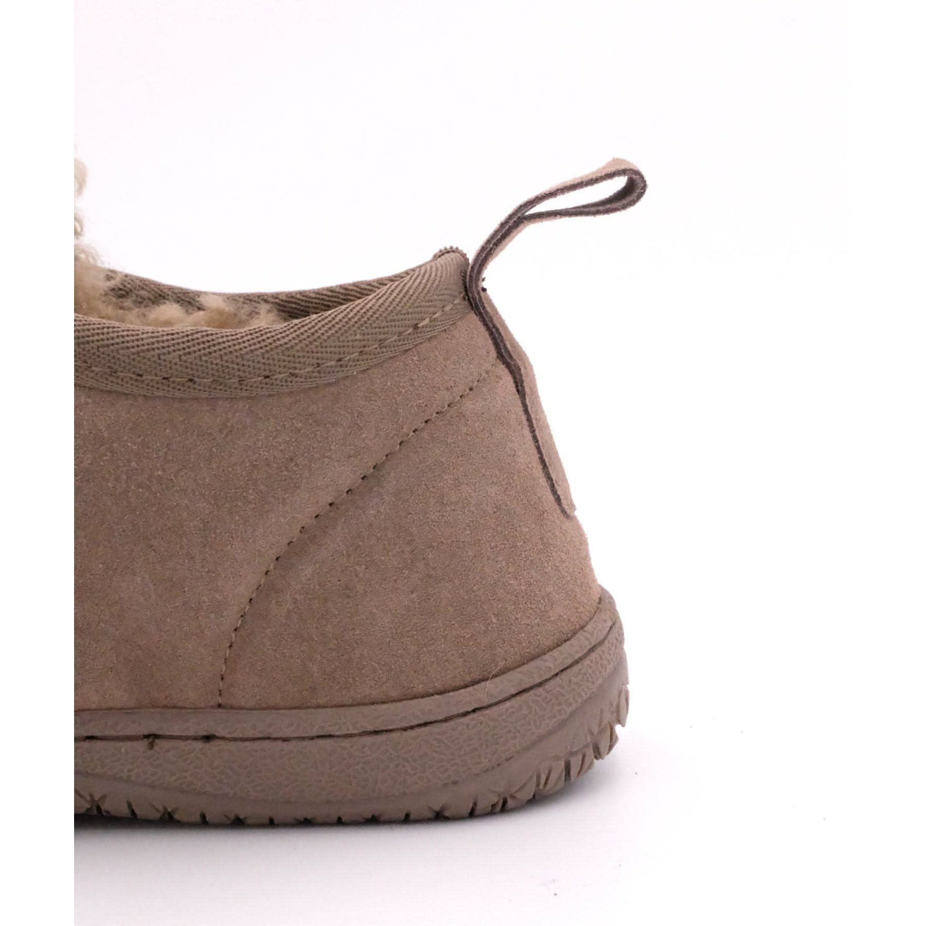 Beige suede sheepskin slipper with wool lining, rear angled view showing pull tab. - Yellow Earth Australia