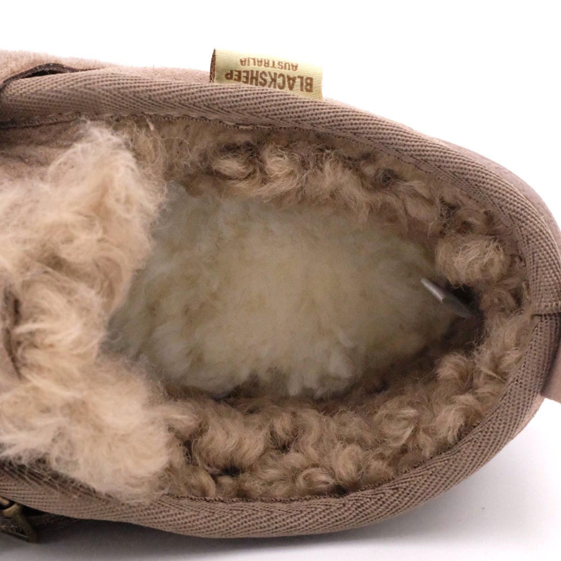 Beige sheepskin slipper interior showing soft wool lining and cushioned sole, top view. - Yellow Earth Australia