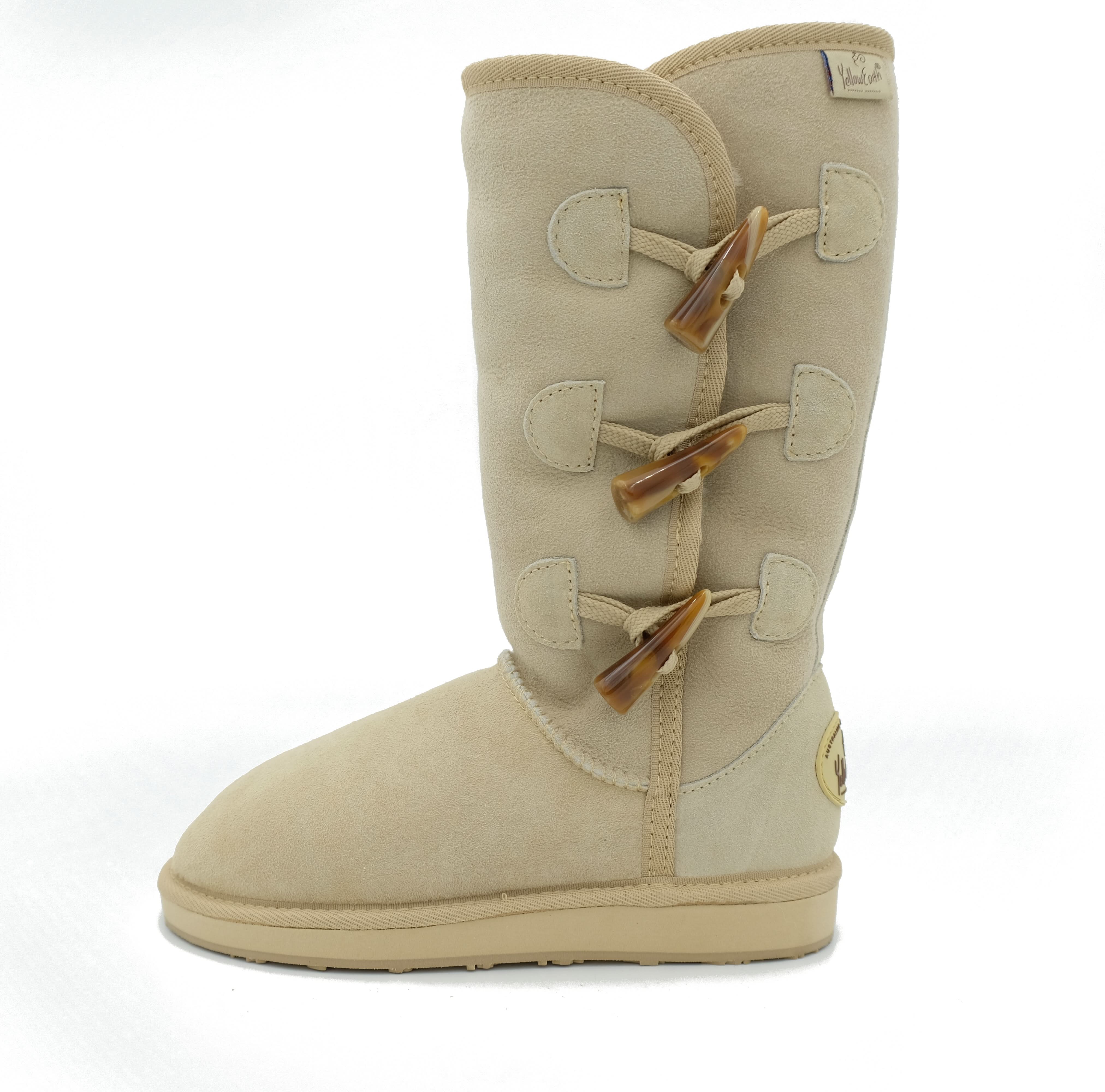 Beige sheepskin tall boot with wooden toggle closures, side view. - Yellow Earth Australia