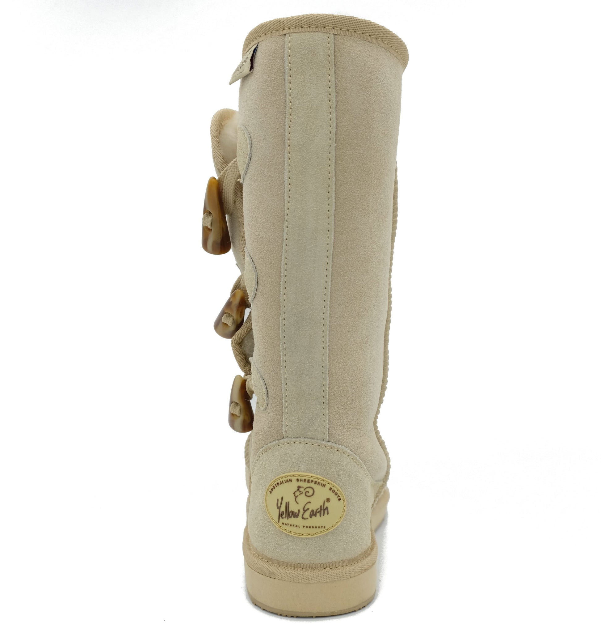 Tall cream sheepskin boot with side buckle closures, rear view. - Yellow Earth Australia