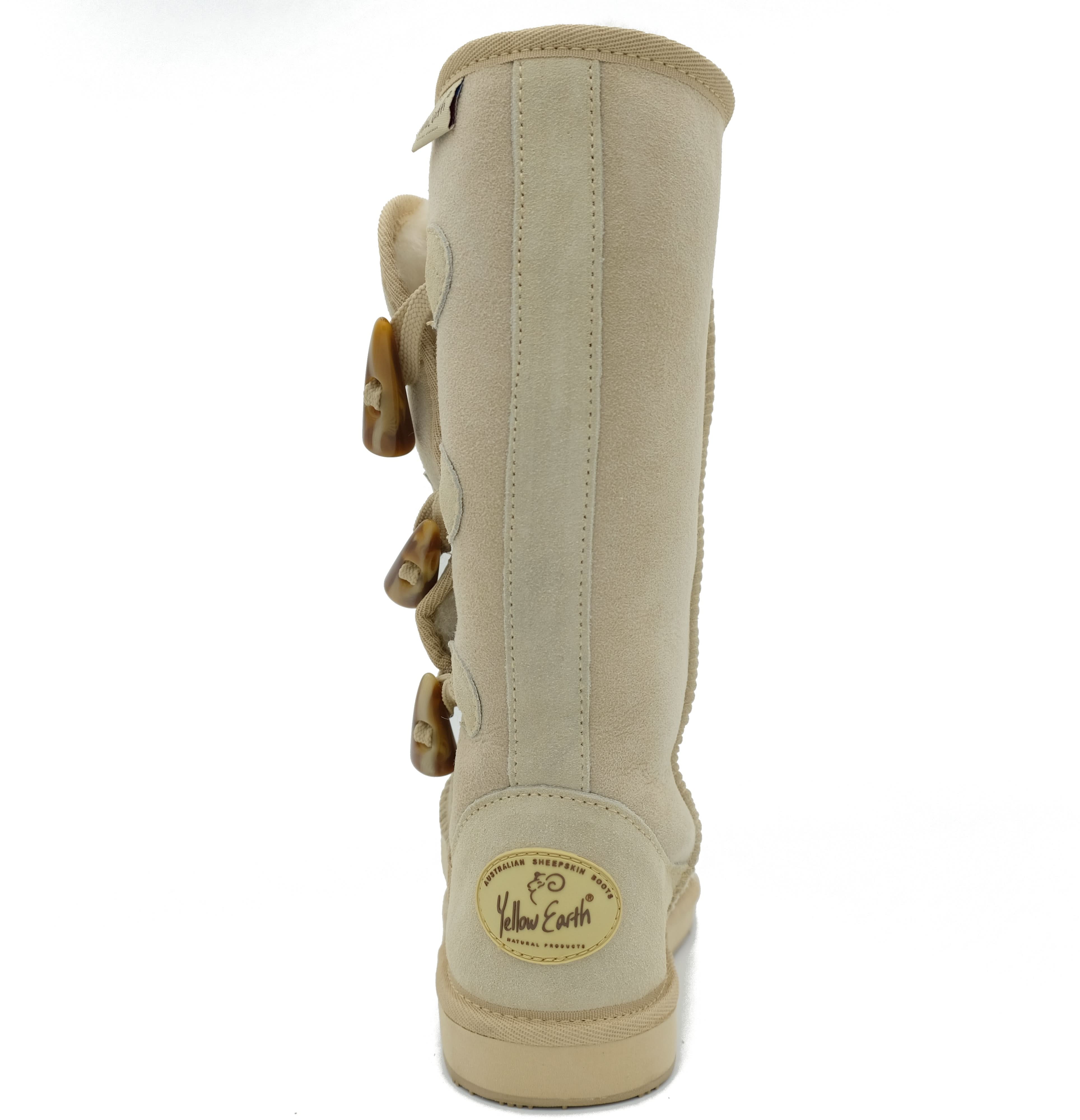 Tall cream sheepskin boot with side buckle closures, rear view. - Yellow Earth Australia