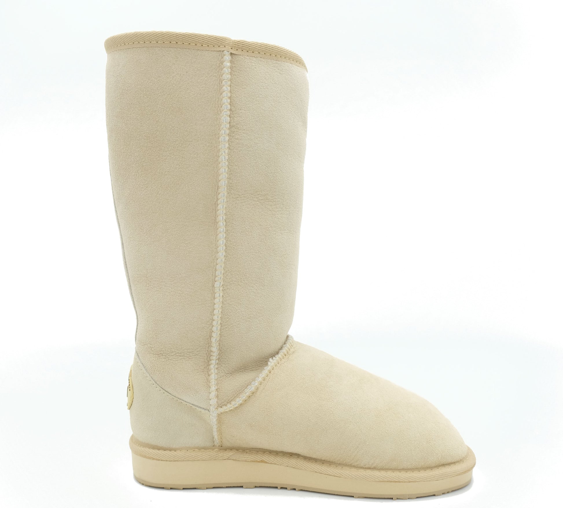 Tall cream sheepskin wool boot shown from the side with visible stitching detail. - Yellow Earth Australia