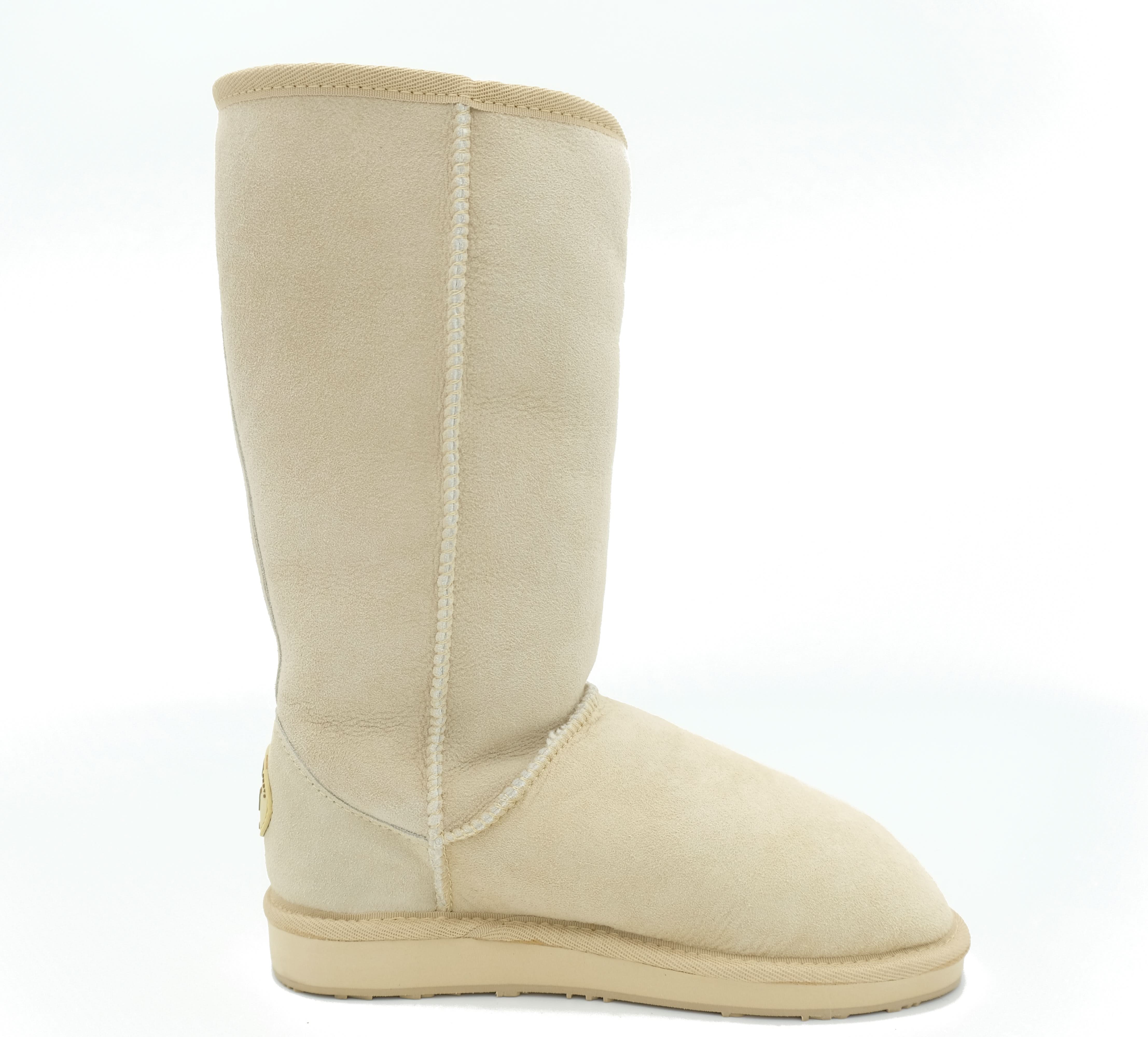 Tall cream sheepskin wool boot shown from the side with visible stitching detail. - Yellow Earth Australia