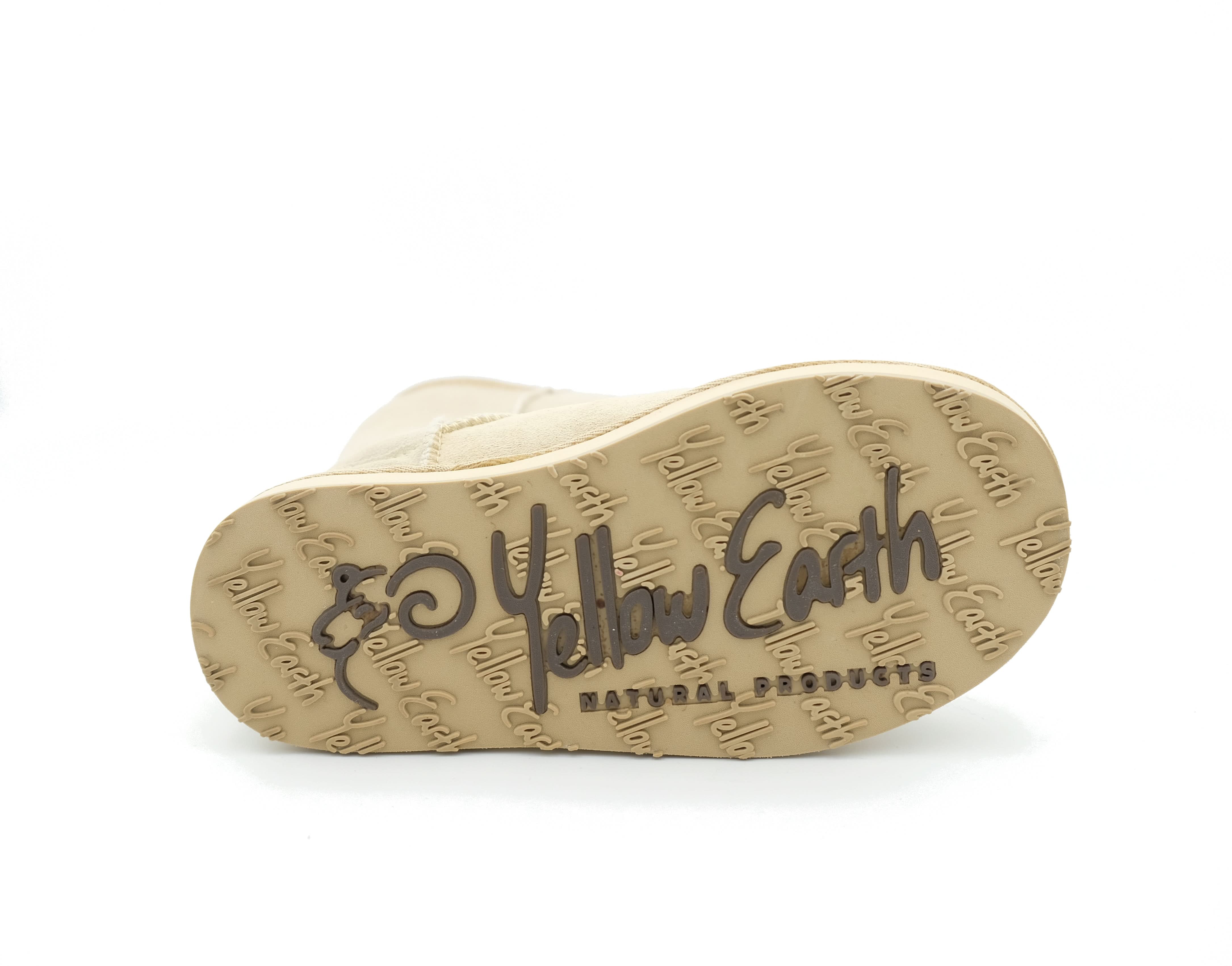 Beige sheepskin slipper with textured sole, bottom view. - Yellow Earth Australia