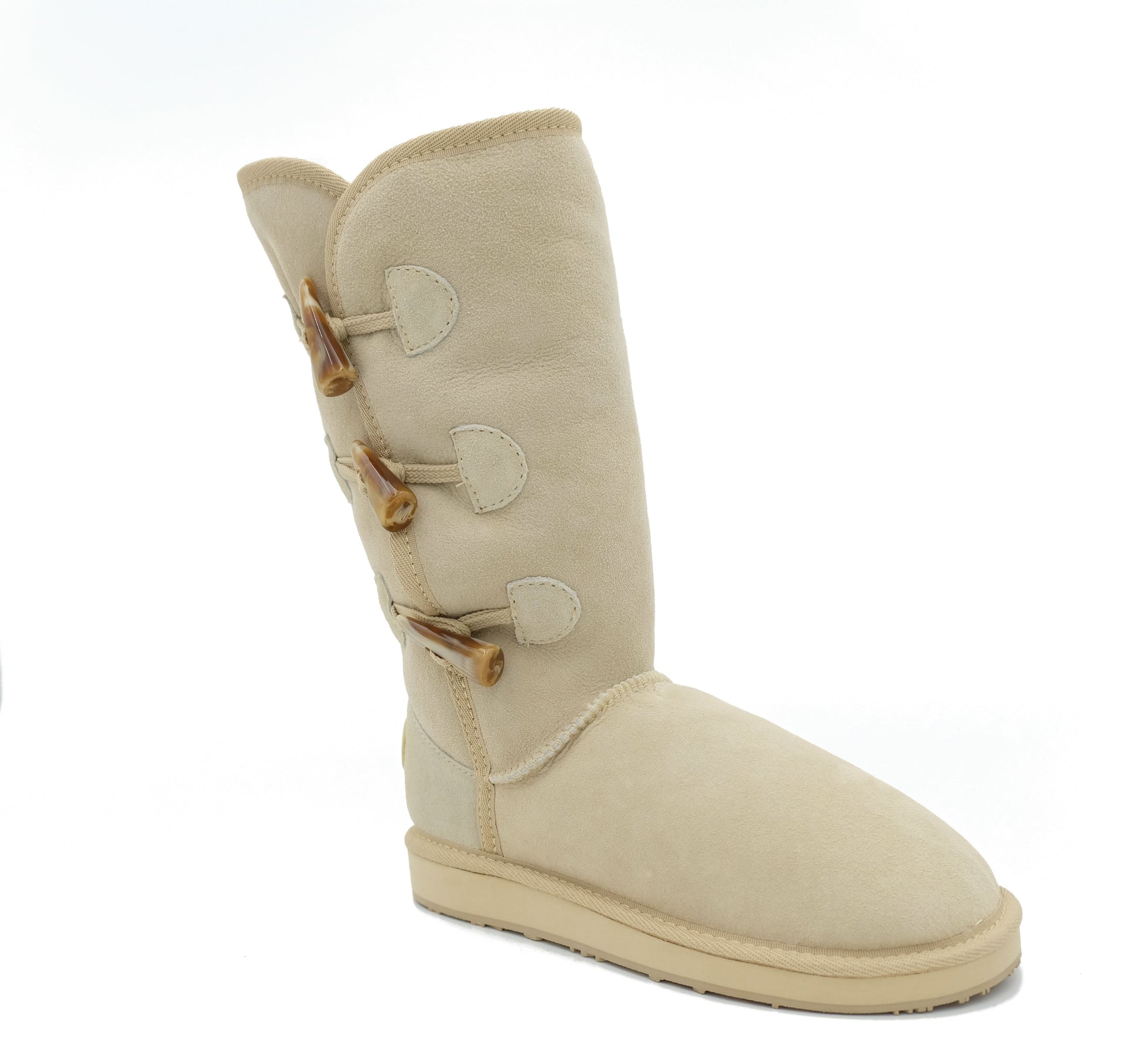 Cream sheepskin mid-calf boot with wooden toggle buttons, side view. - Yellow Earth Australia