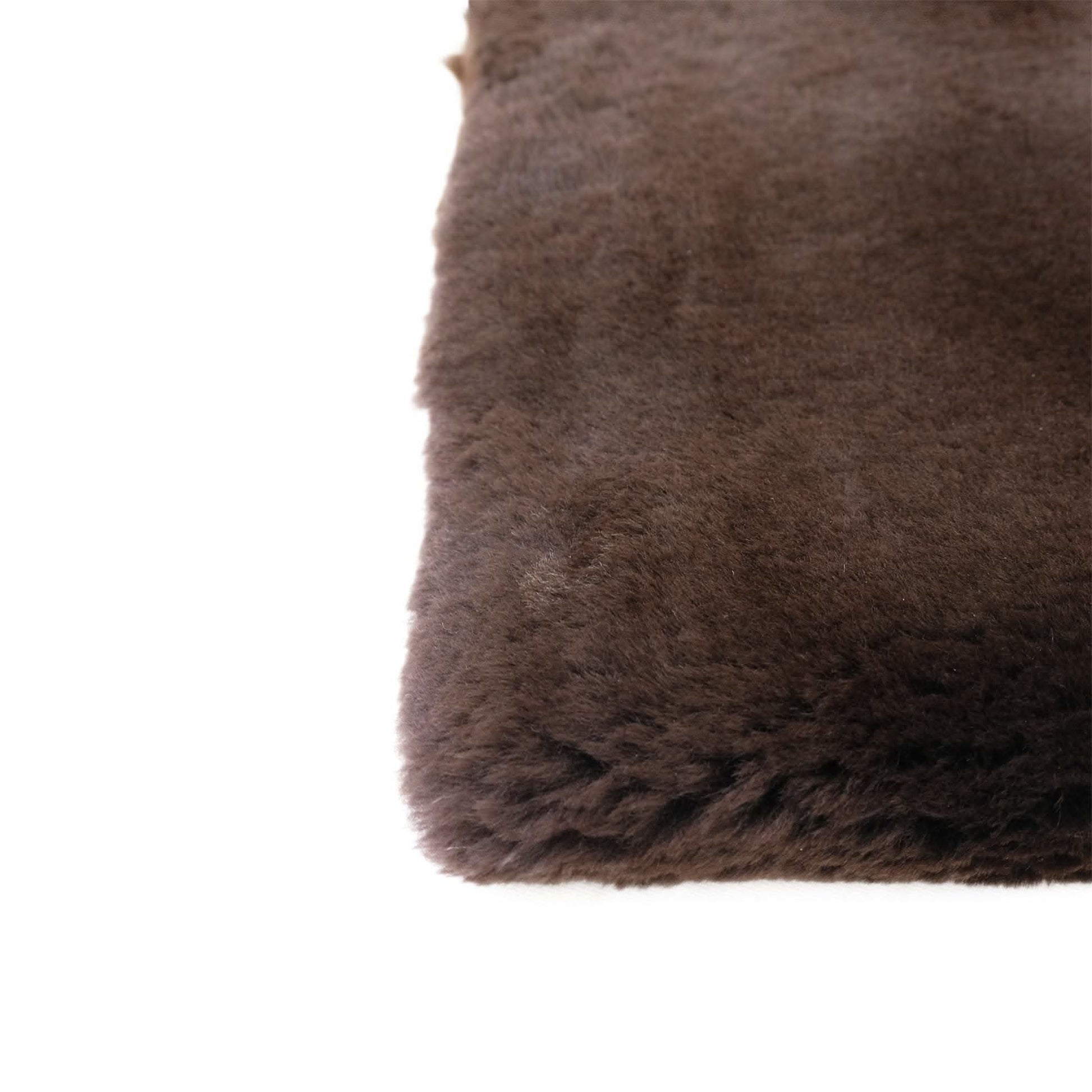 Taupe sheepskin rug with soft wool pile, corner detail view. - Yellow Earth Australia