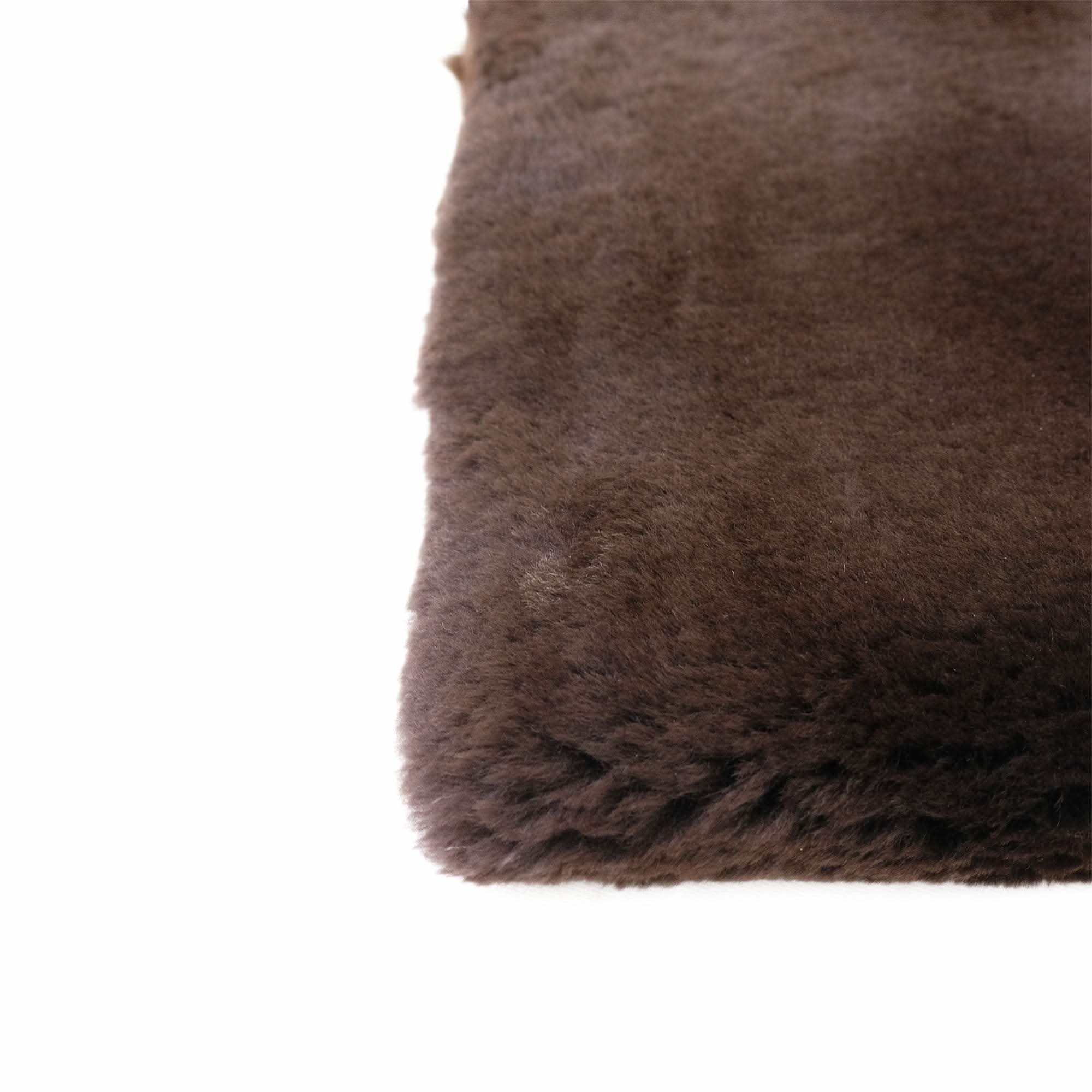 Taupe sheepskin rug with soft wool pile, corner detail view. - Yellow Earth Australia