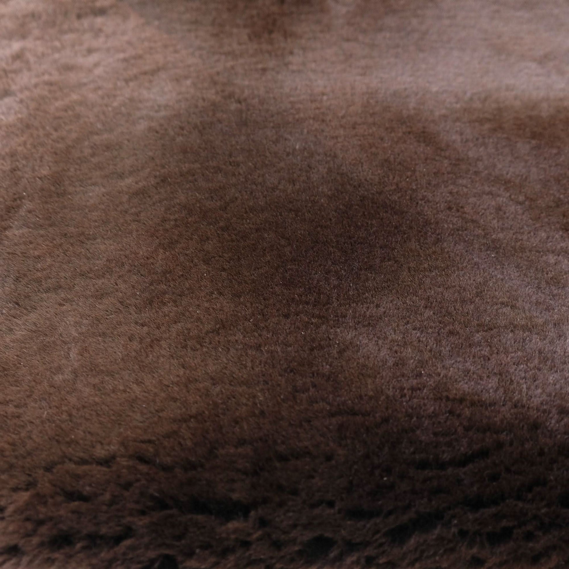 Close-up view of soft brown sheepskin rug showing dense wool texture and natural fibers. - Yellow Earth Australia