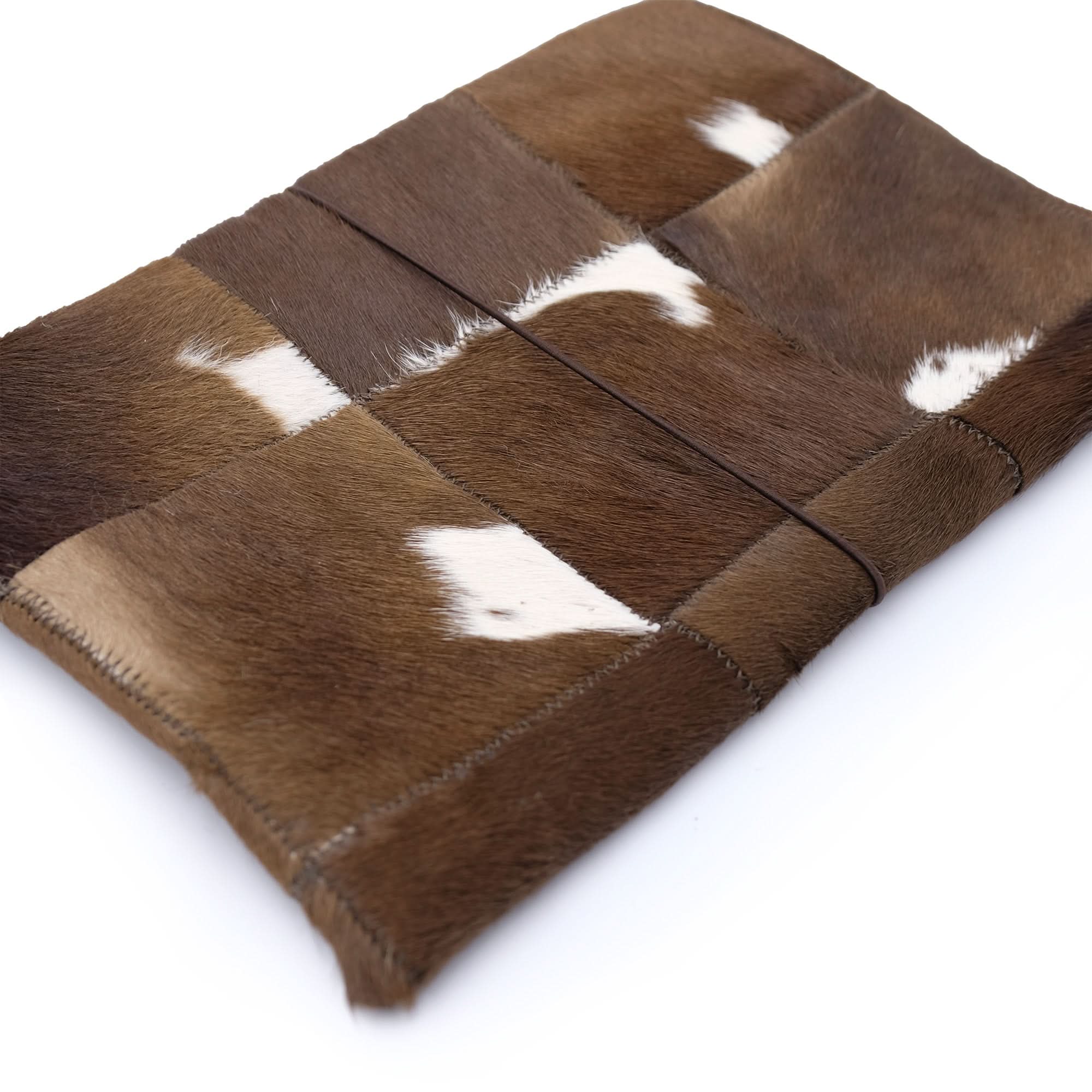 Brown and white patchwork sheepskin wallet displayed open showing interior compartments. - Yellow Earth Australia