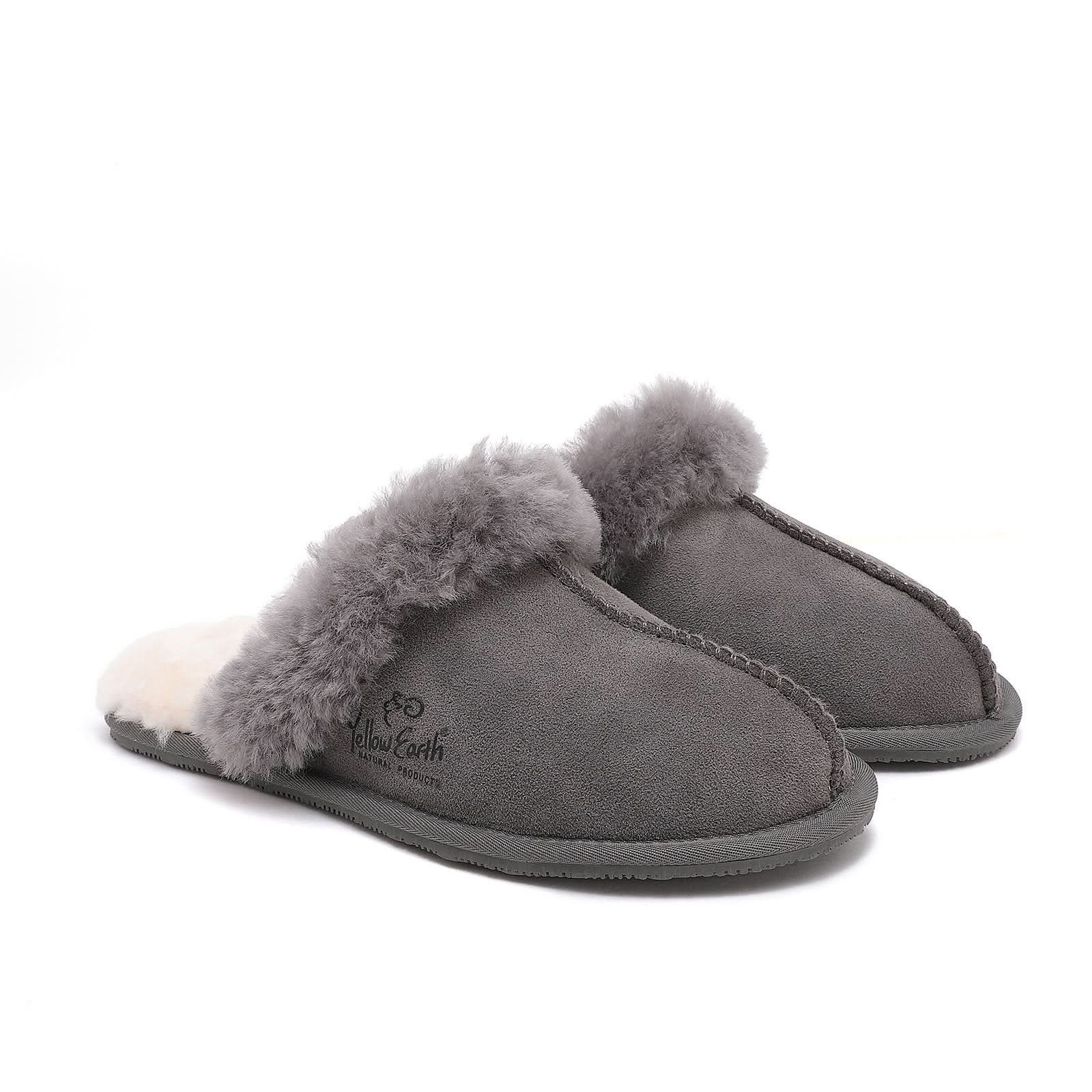 Grey sheepskin slippers with fluffy wool cuff, angled side view. - Yellow Earth Australia