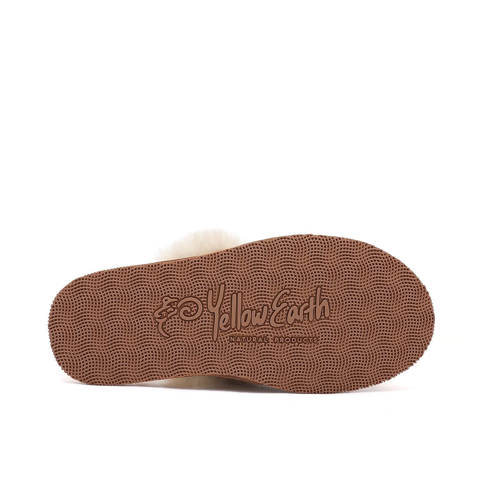 Cream sheepskin slipper sole with textured brown grip pattern, bottom view. - Yellow Earth Australia