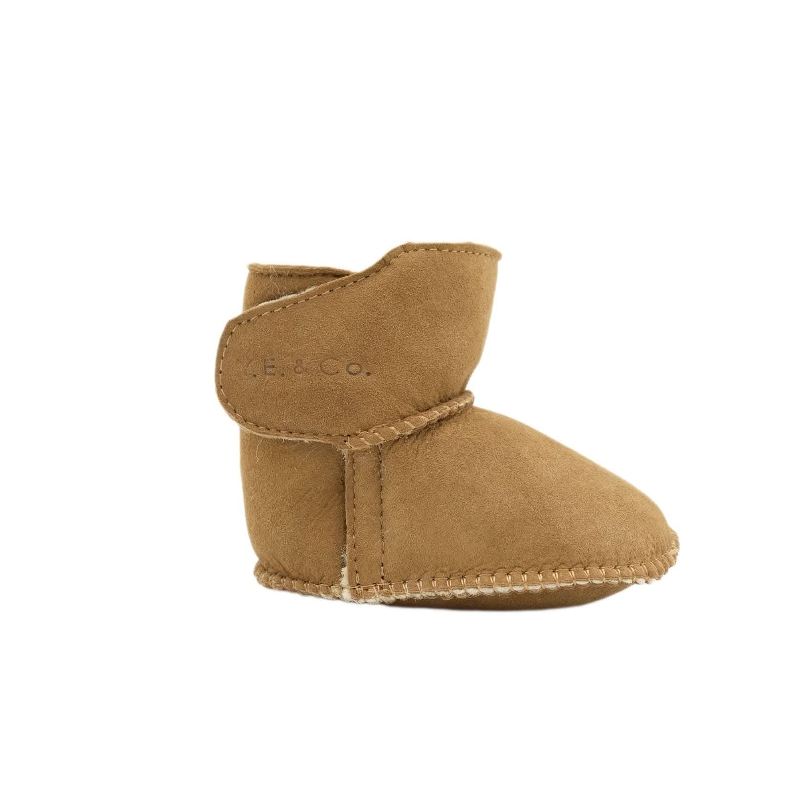 Tan sheepskin baby bootie with whipstitched edging, side view. - Yellow Earth Australia