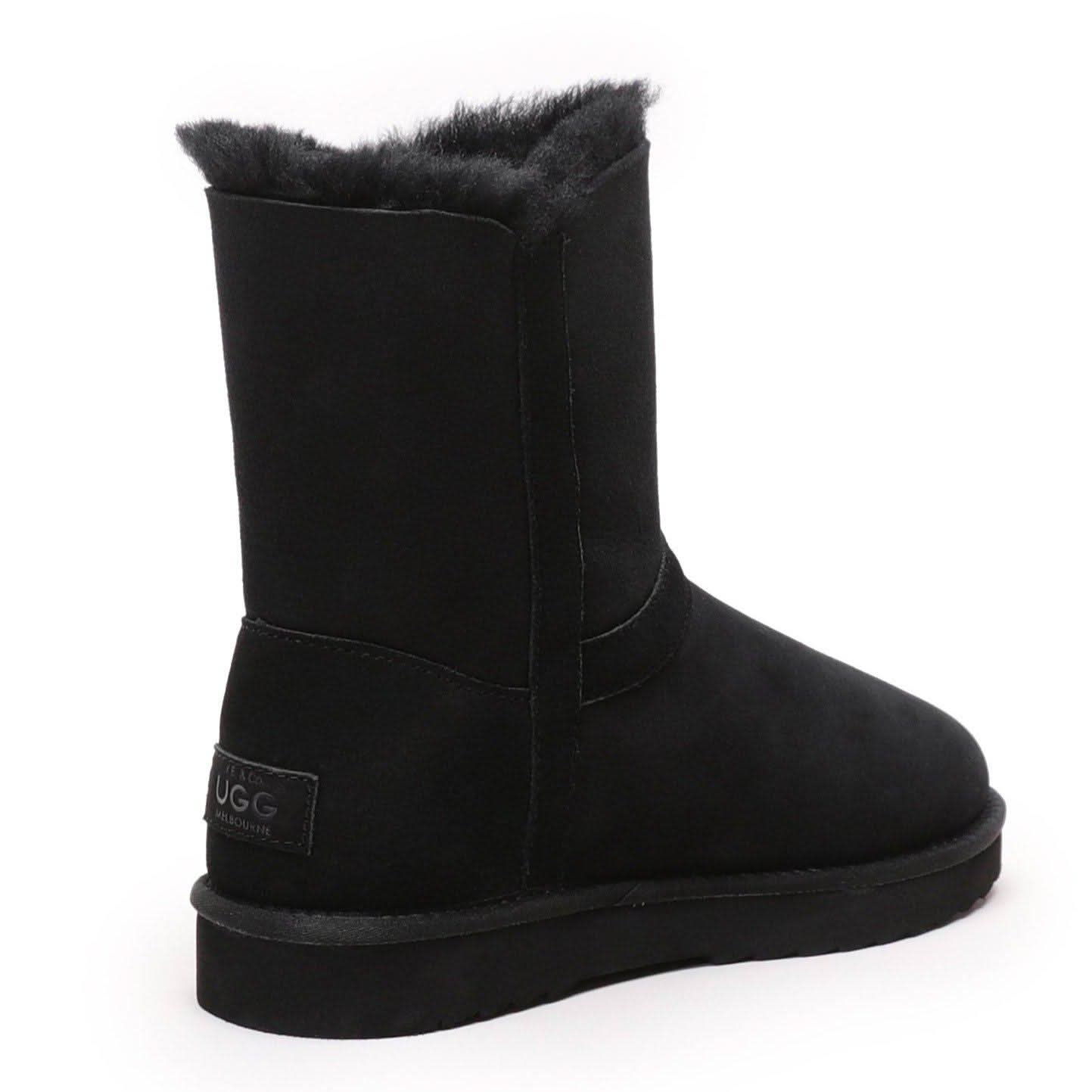 Black sheepskin boot with fluffy wool lining, rear three-quarter view. - Yellow Earth Australia