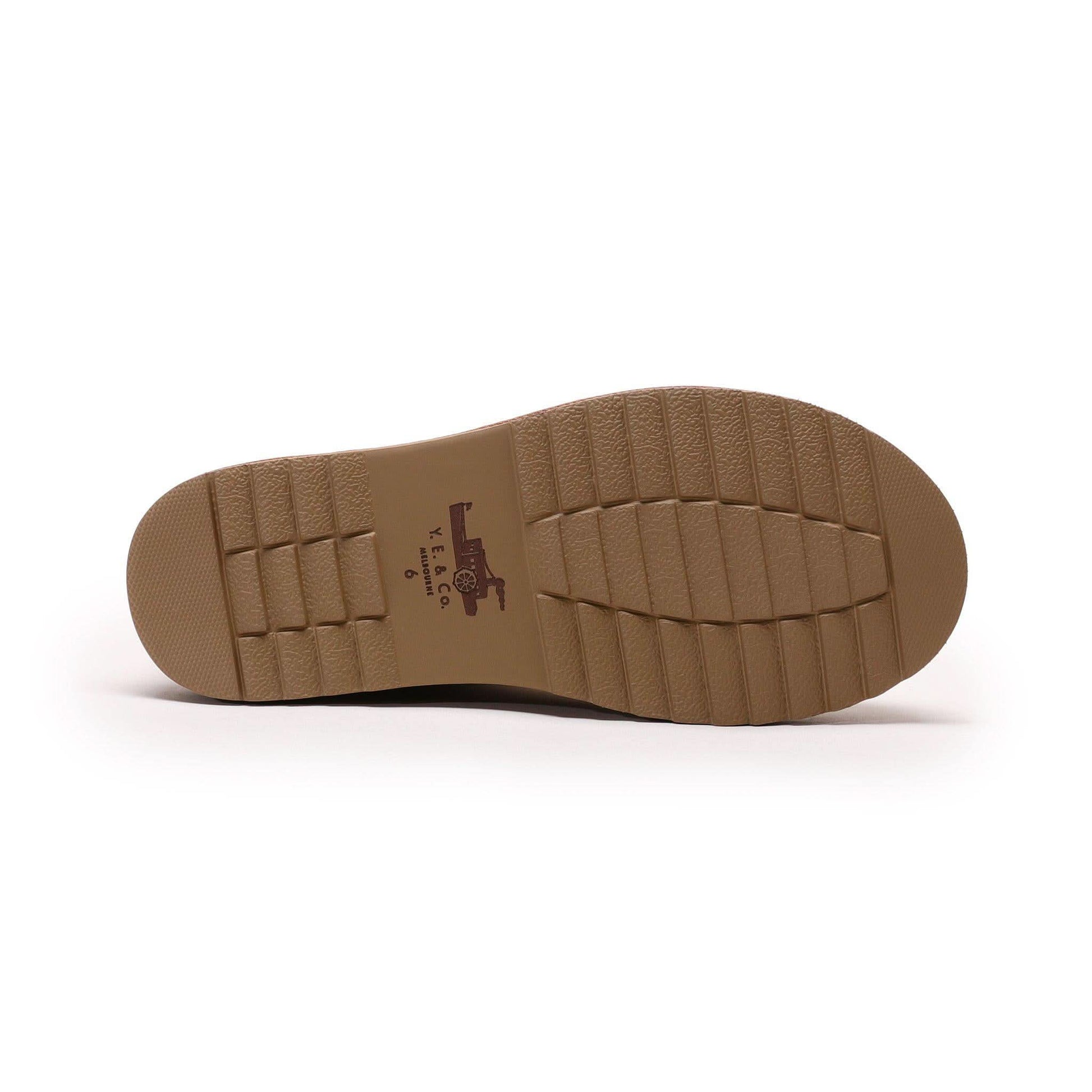 Tan crepe rubber sole for sheepskin boots, bottom view showing textured tread pattern. - Yellow Earth Australia
