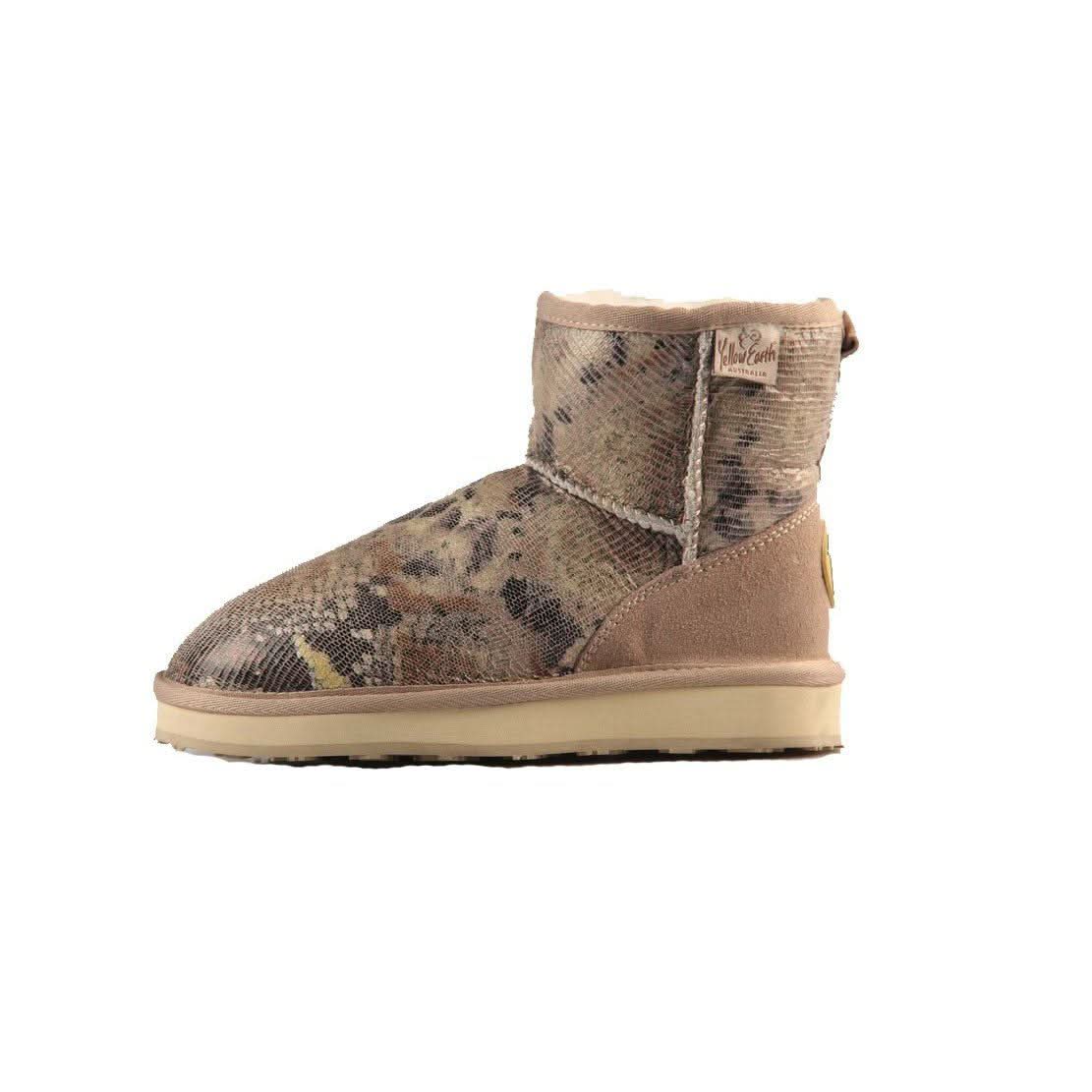 Beige snake-print sheepskin mini boot with cream sole, side view. - Yellow Earth Australia