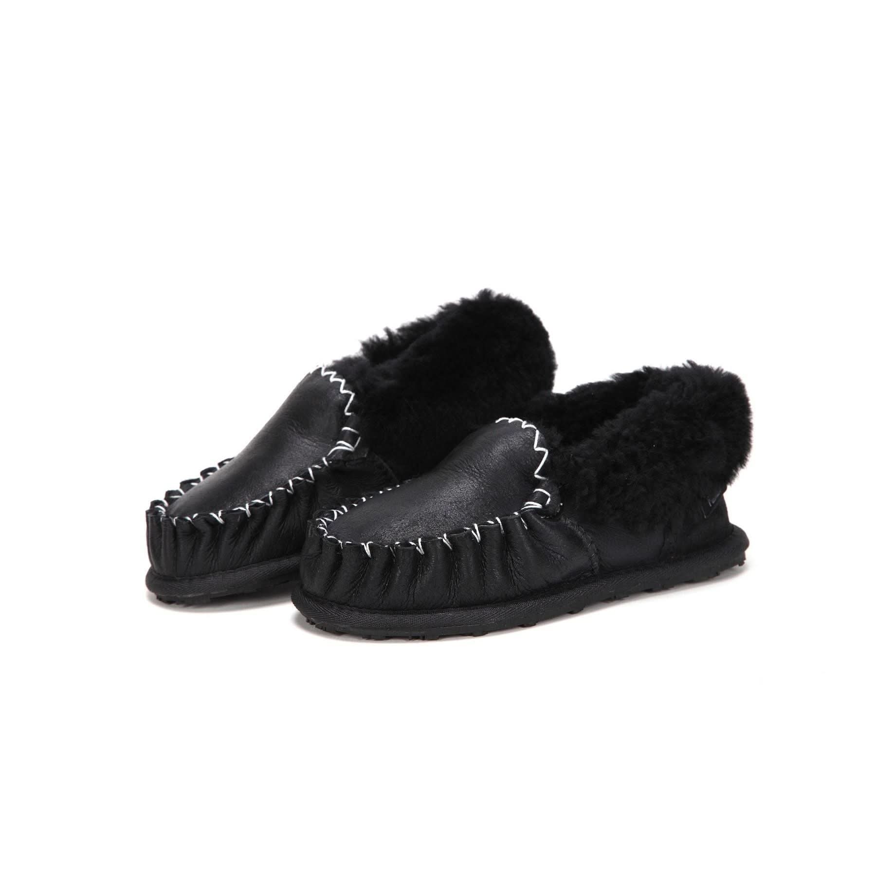 Black sheepskin moccasin slippers with wool lining, three-quarter front view. - Yellow Earth Australia