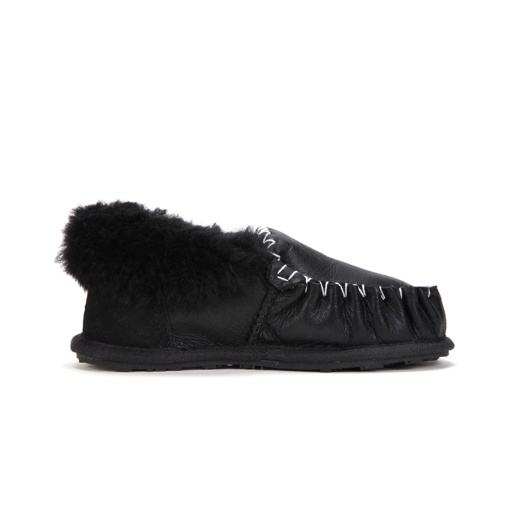 Black sheepskin slipper with fluffy wool cuff, side view on white background. - Yellow Earth Australia