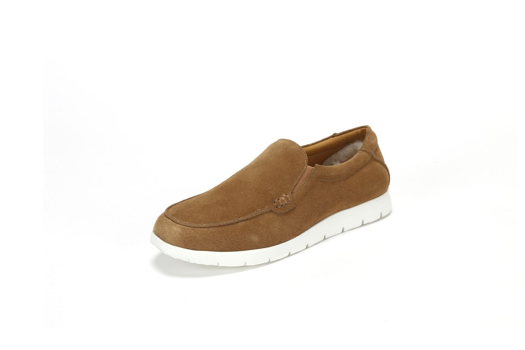 Tan suede sheepskin moccasin slipper with white sole, angled side view. - Yellow Earth Australia