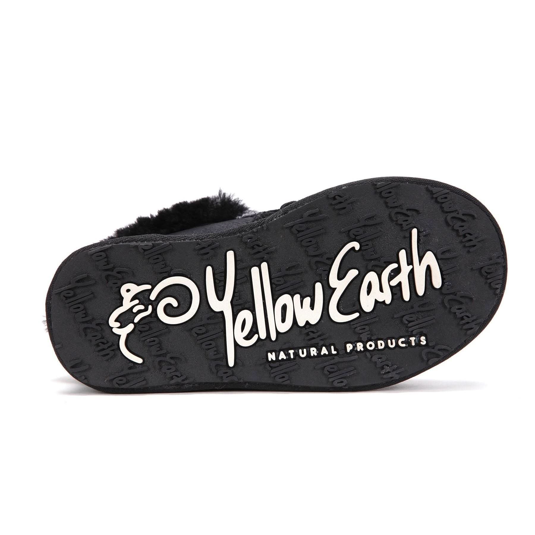 Black sheepskin slipper sole showing fluffy wool lining and textured rubber tread, bottom view. - Yellow Earth Australia