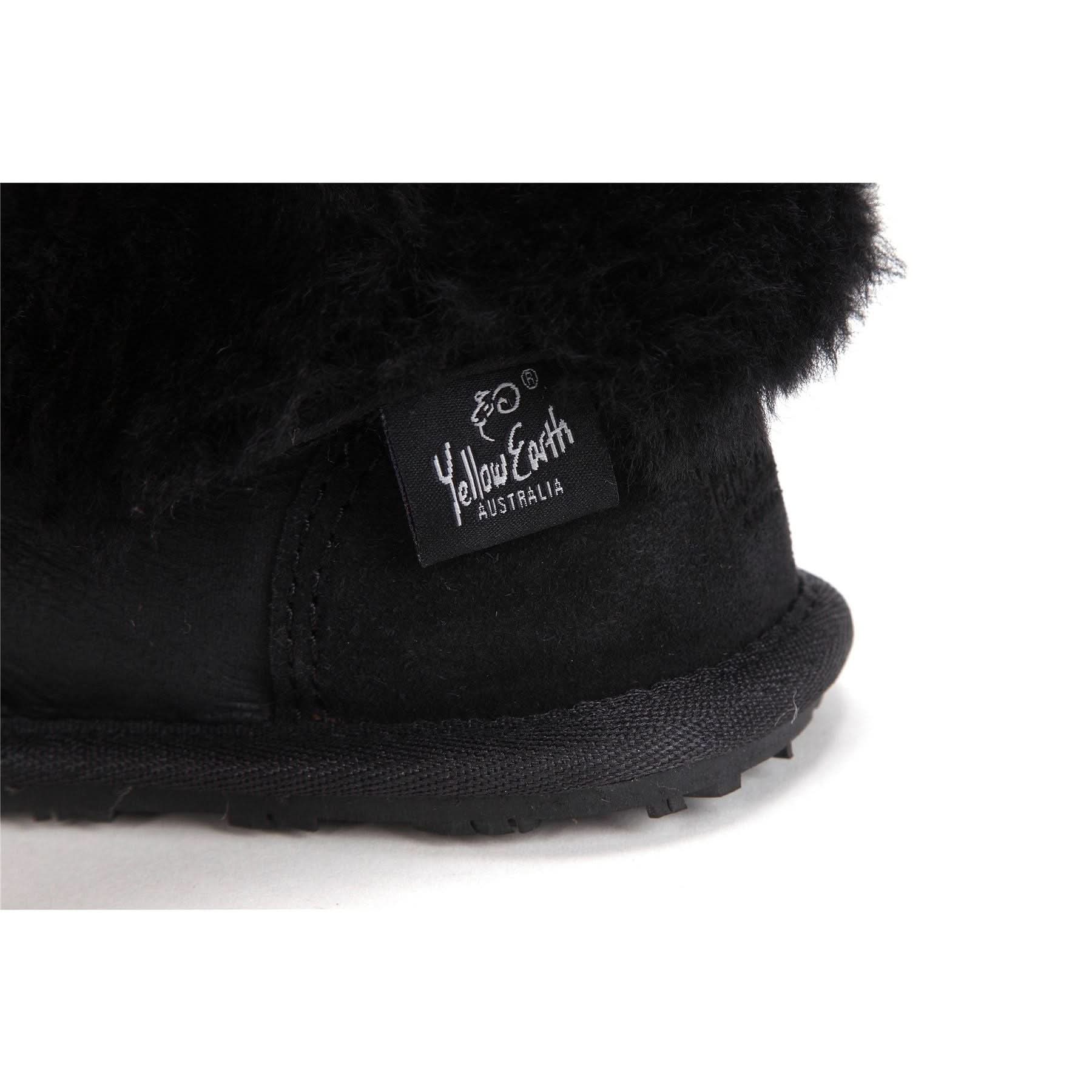 Black sheepskin slipper boot with fuzzy wool exterior, side view detail. - Yellow Earth Australia