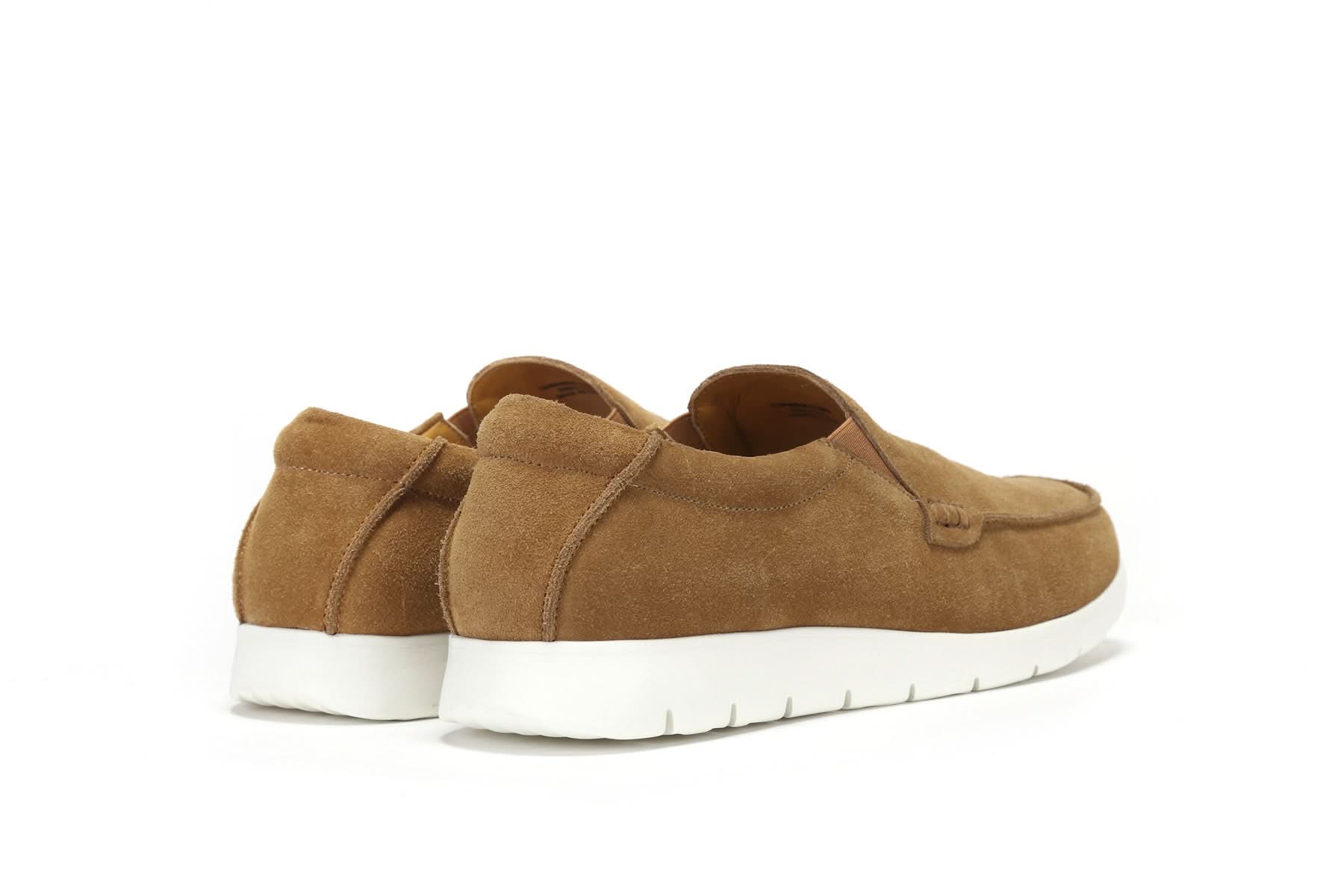 Tan suede slip-on shoes with white sole, rear three-quarter view. - Yellow Earth Australia
