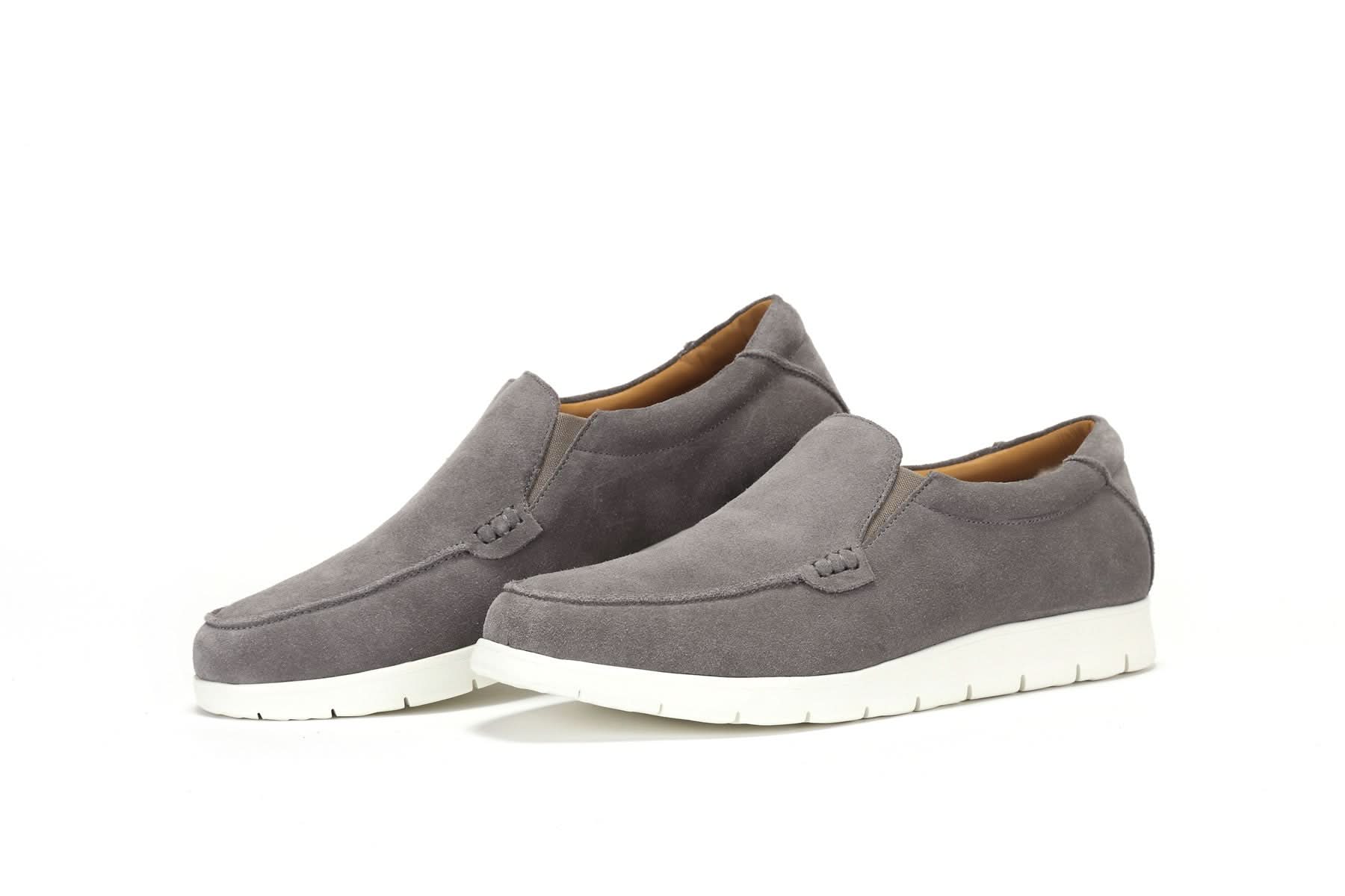Grey suede slip-on loafers with white sole, shown from side angle. - Yellow Earth Australia