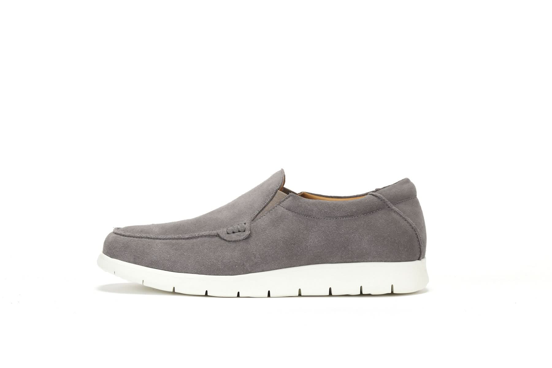 Grey suede slip-on loafer with white sole, side view. - Yellow Earth Australia
