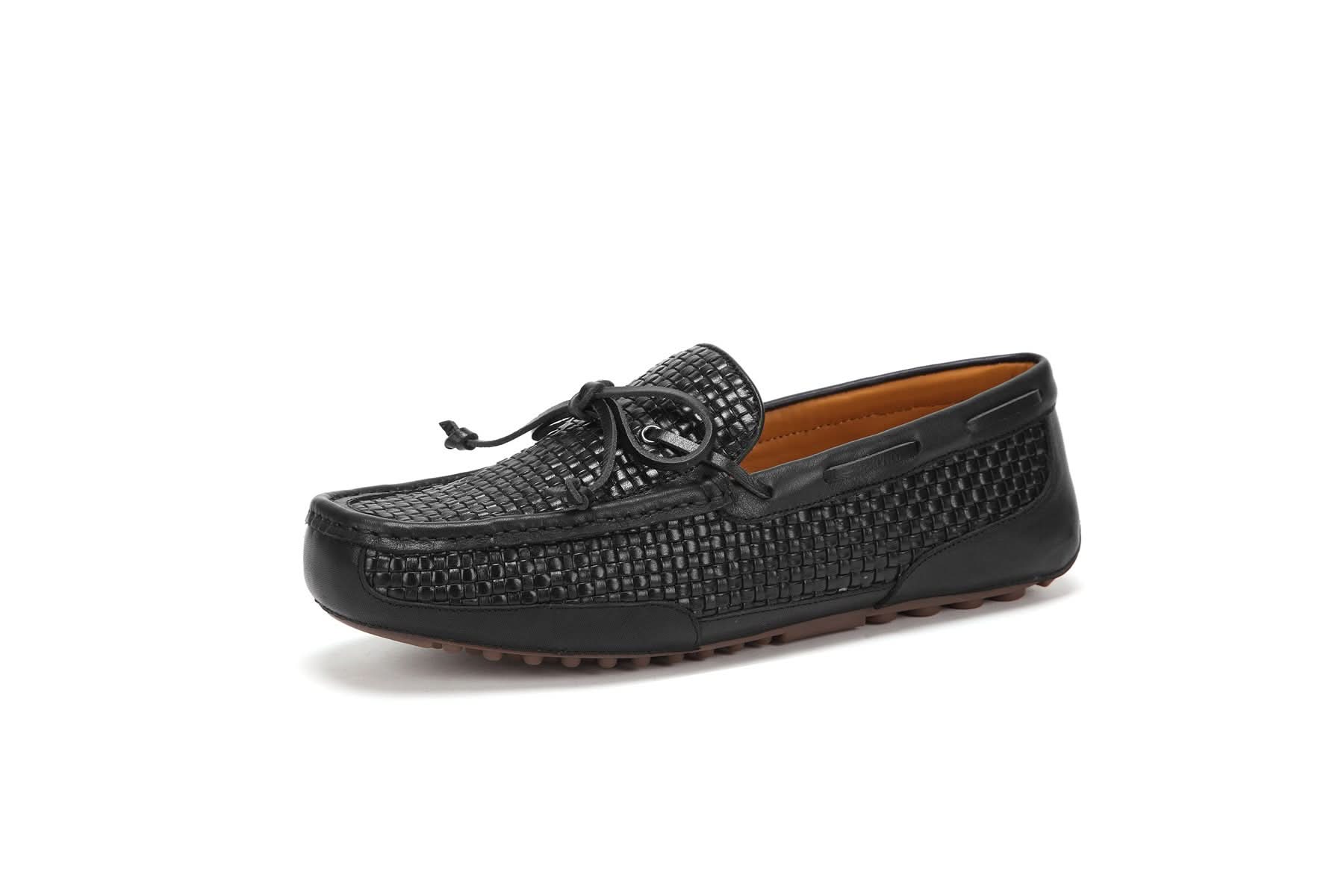 Black woven leather loafer with tassel detail, side view. - Yellow Earth Australia