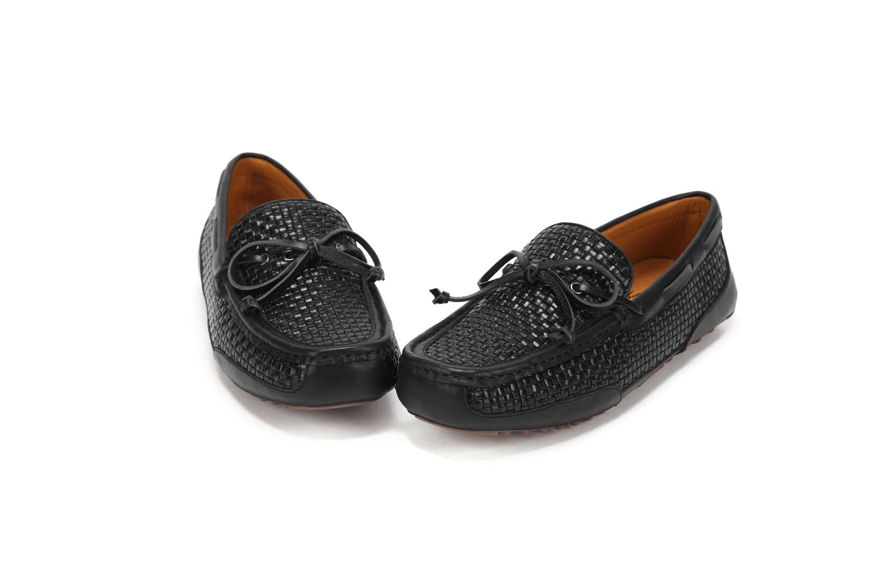 Black woven leather driver loafers with tassel detail, front three-quarter view. - Yellow Earth Australia