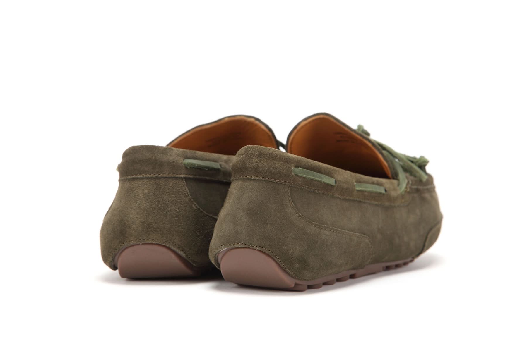 Back view of olive green suede moccasin slippers with rubber sole and leather lining